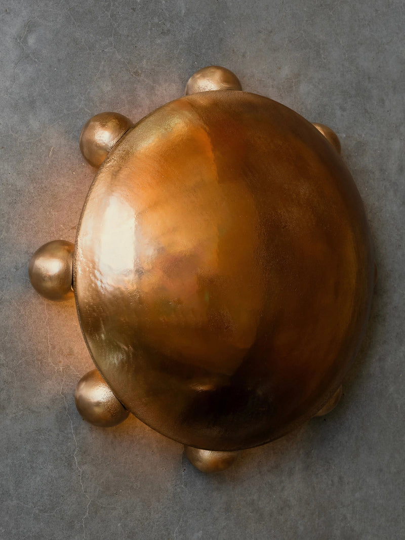 ALTER Sconce | Bronze — close-up of polished bronze surface