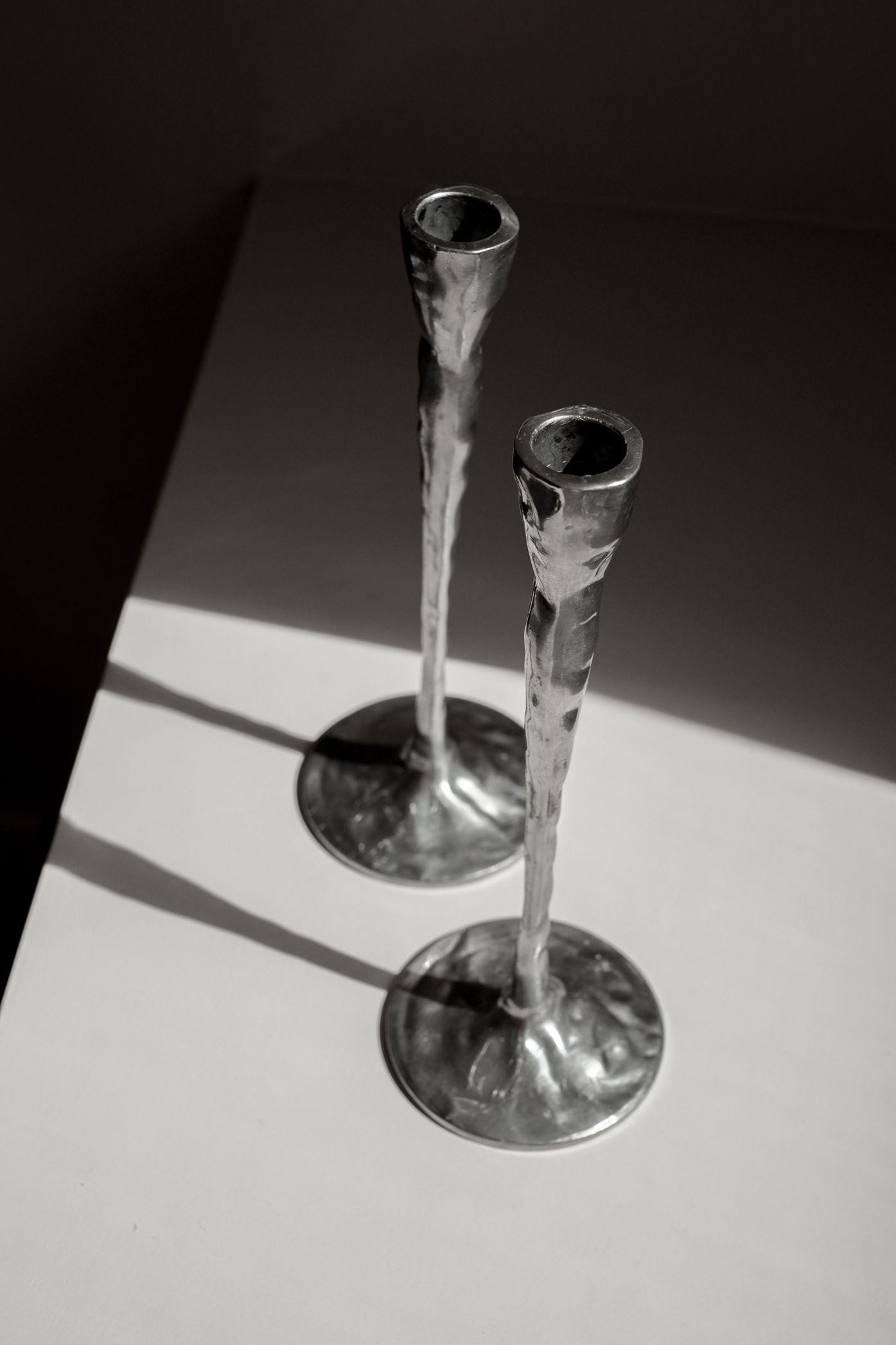 Pair of Aluminium Candle Holders — side angle showing textured surface