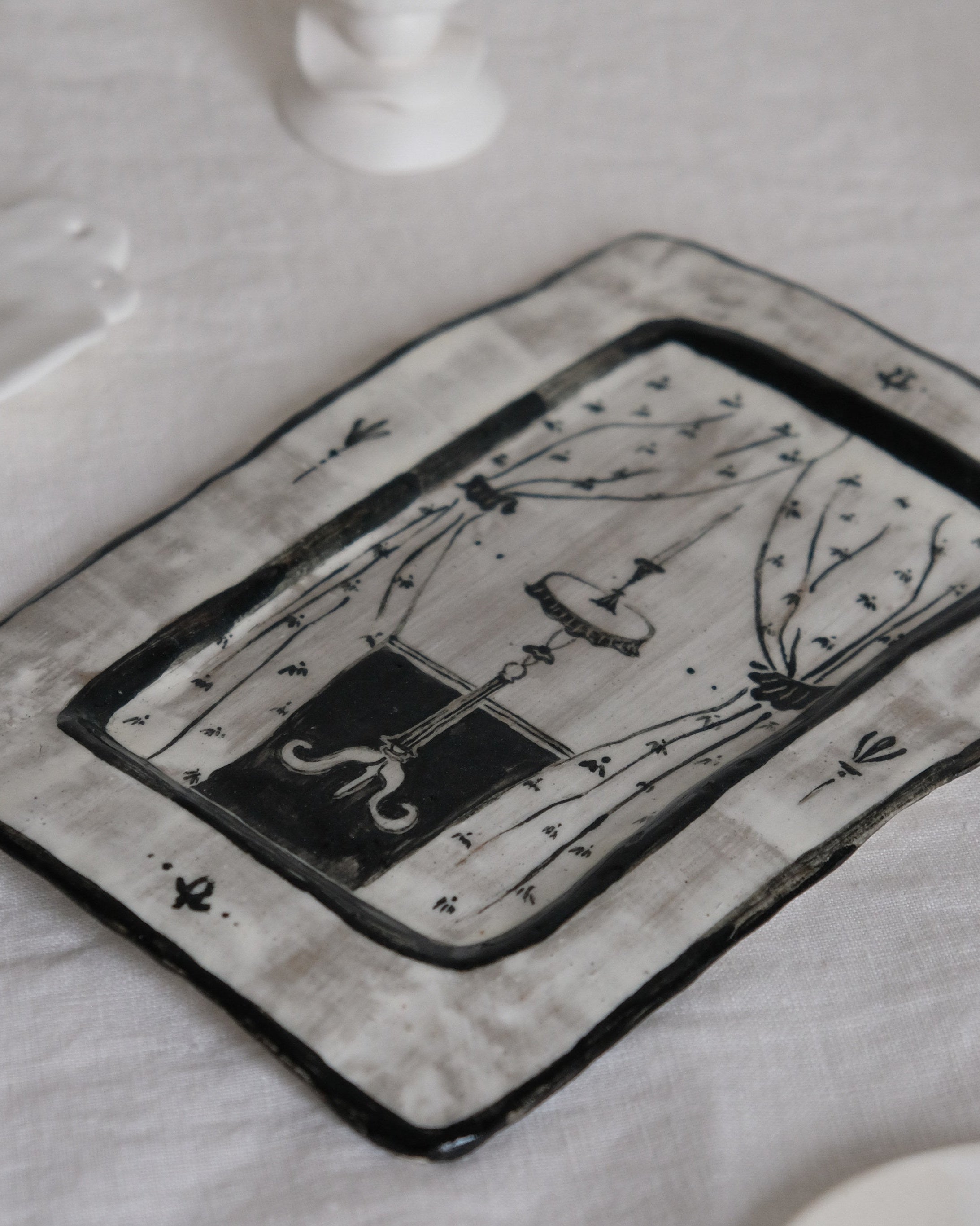 Entrance - Hand Painted Ceramic Plate - side view on textured linen