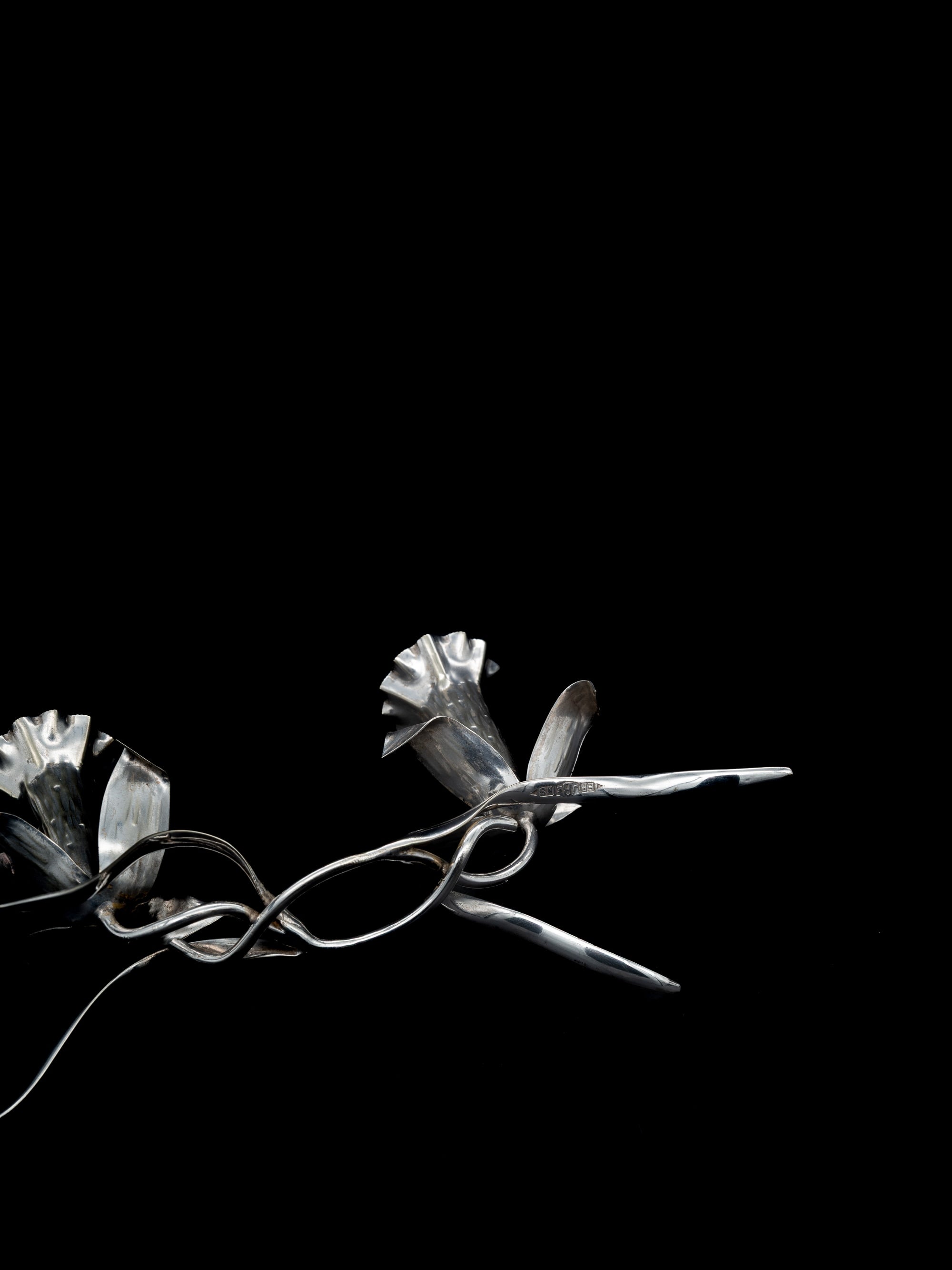 Art Nouveau Silver-Plated Lily Candleholder, England, c. 1900s — angled view on black background