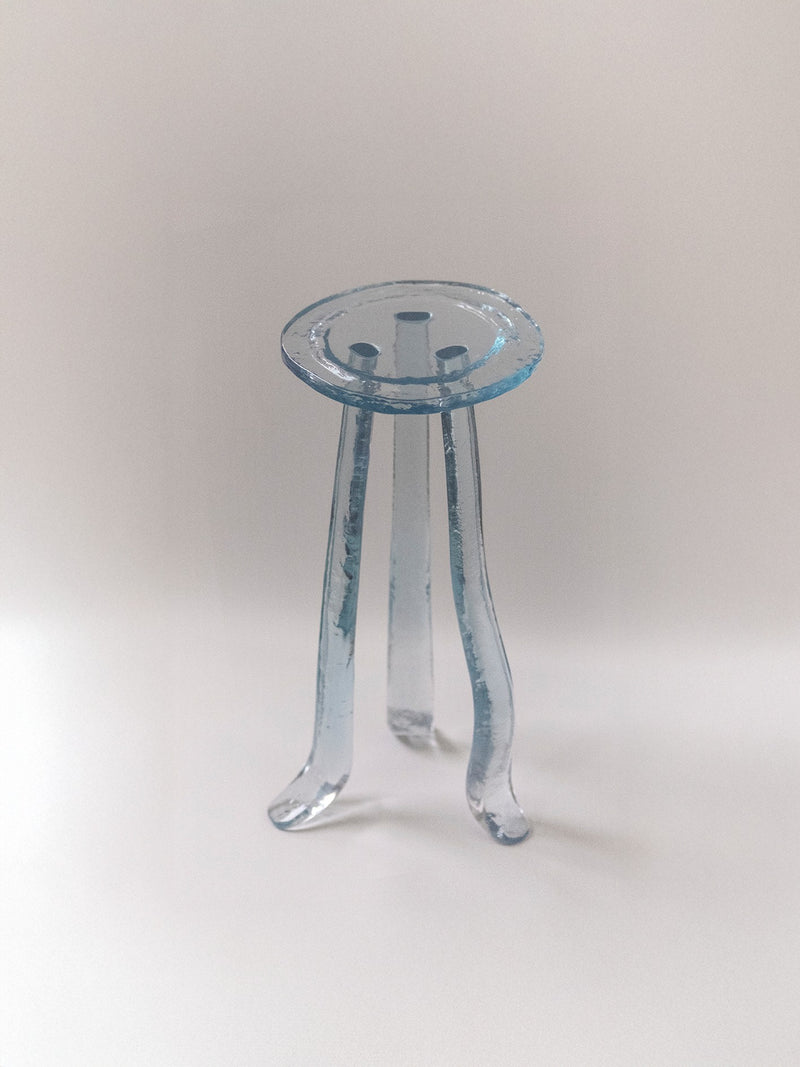 Translucent blue glass side table with curved tripod legs by Szymon Keller