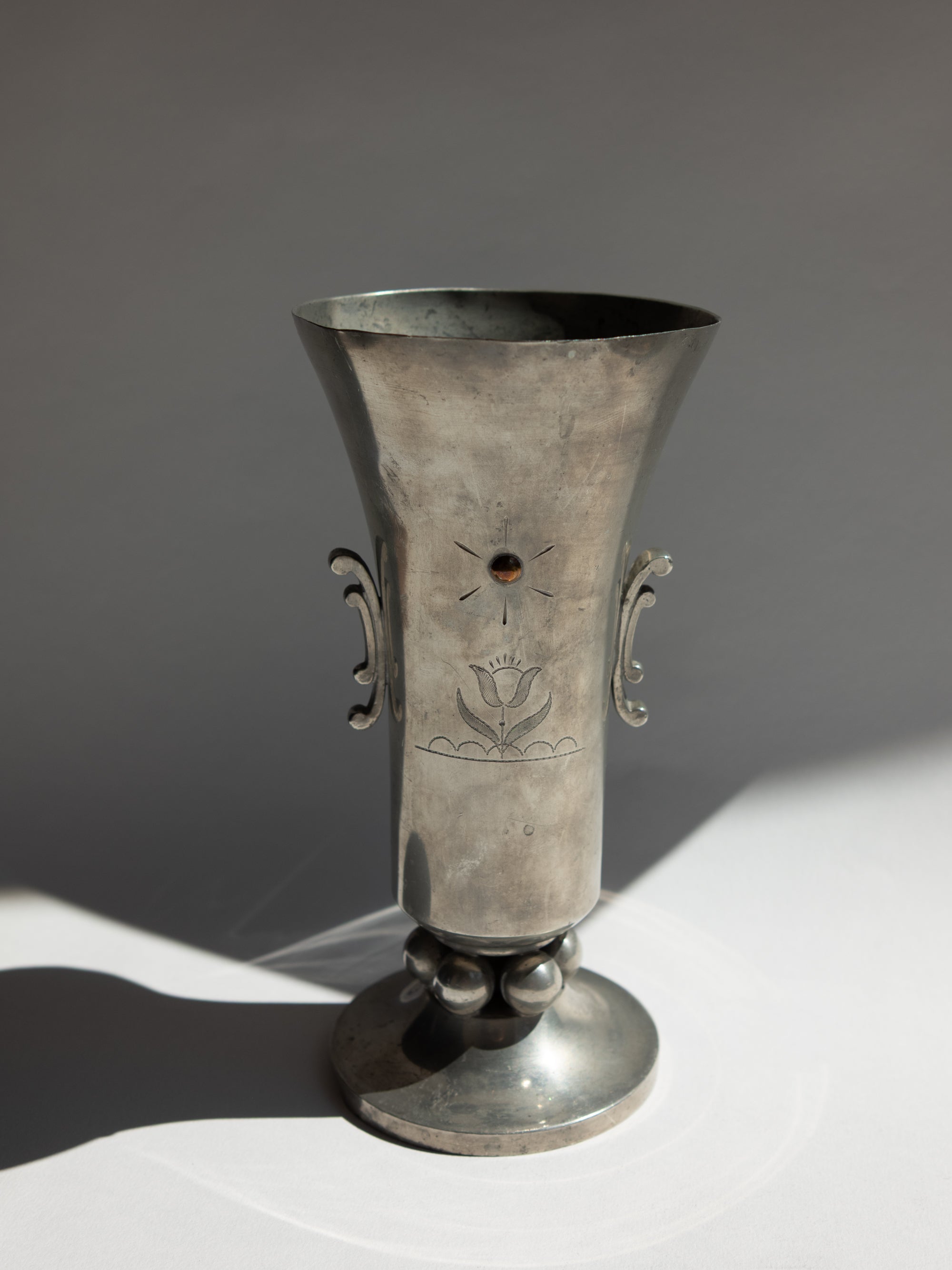 Swedish Grace Pewter Sunburst & Tulip Vase by J.L. Hultman for Svenskt Tenn — lifestyle setting