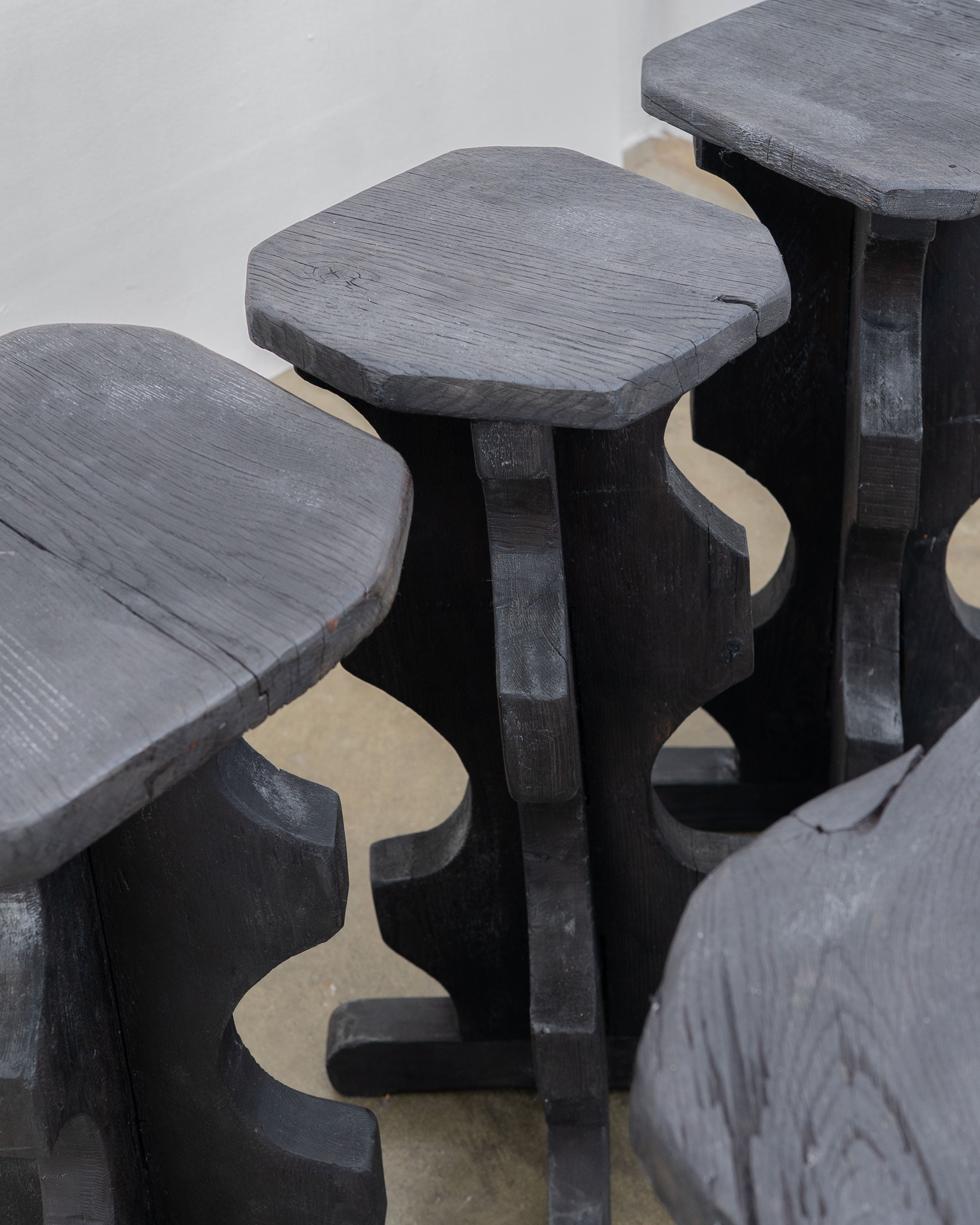 Sculptural Brutalist Bar Stools — back view of dark wood design