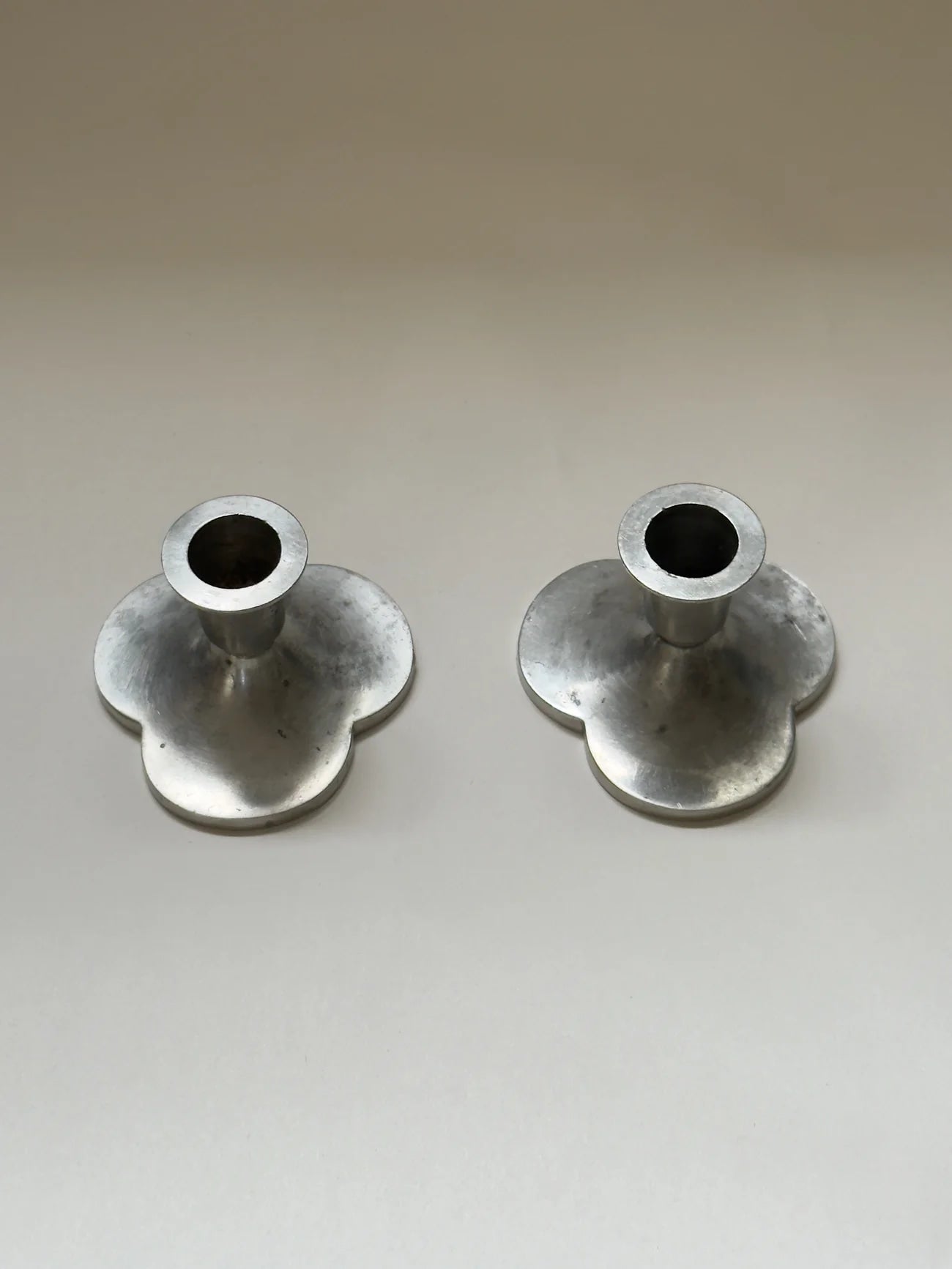 Pair of Pewter Candlesticks by Just Andersen — top view highlighting smooth pewter finish