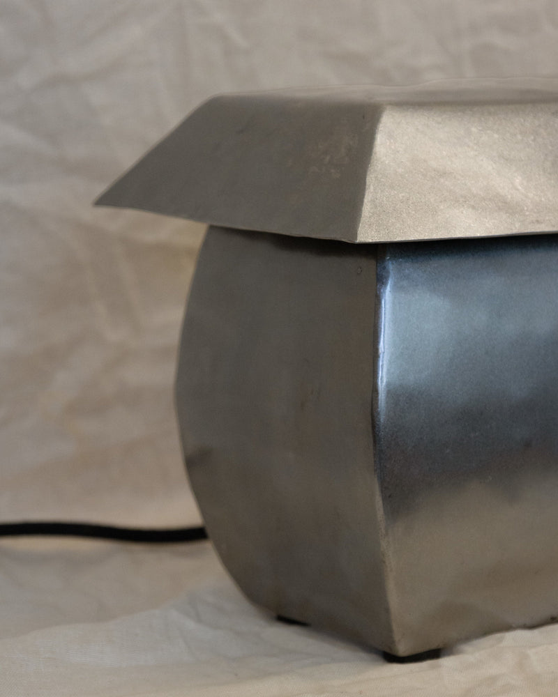 Wide hammered steel table lamp base detail view