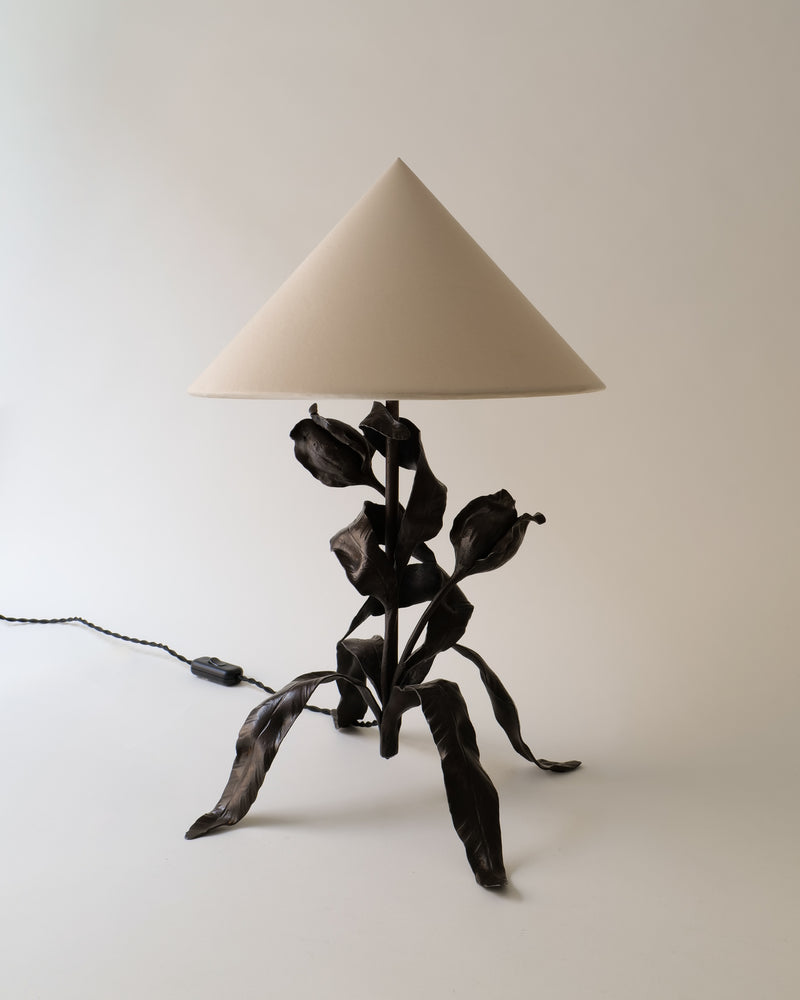 Wilting Flower Wrought Iron Table Lamp 1920s — close-up of dark iron base with beige shade