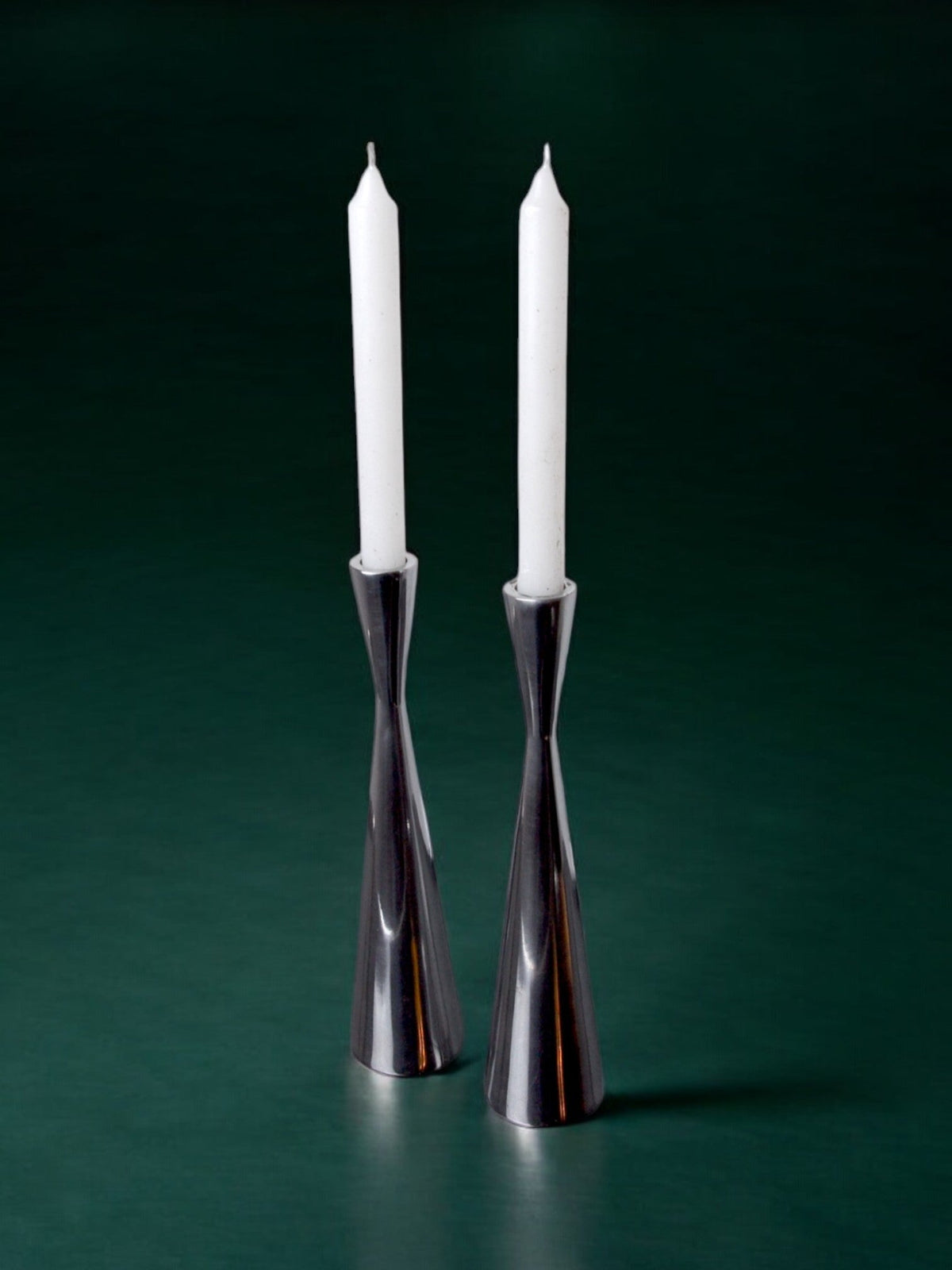 Pair of Scandinavian diabolo candlesticks, aluminium, suede, 1970 — detail view