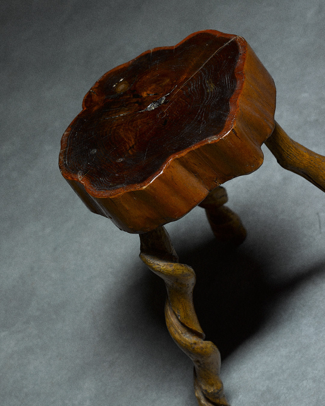 Small Tripod Stool — angled view of handcrafted wooden seat
