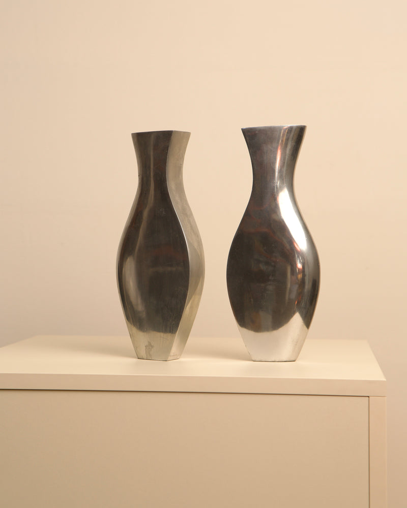 Pair of Italian aluminum Dame vases with curved silhouettes, 1980s