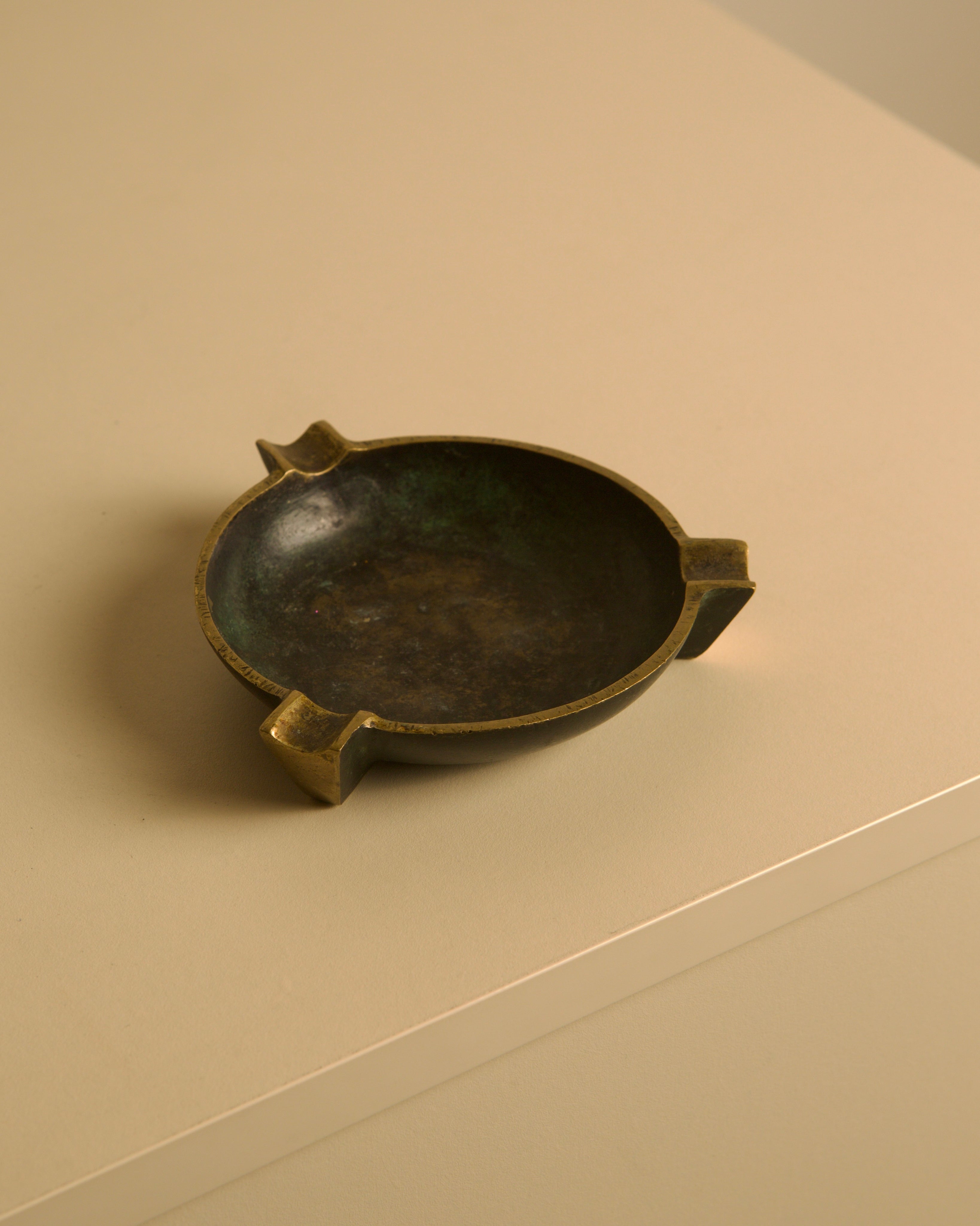 Italian Bronze Ashtray, 1940s — side angle on neutral surface
