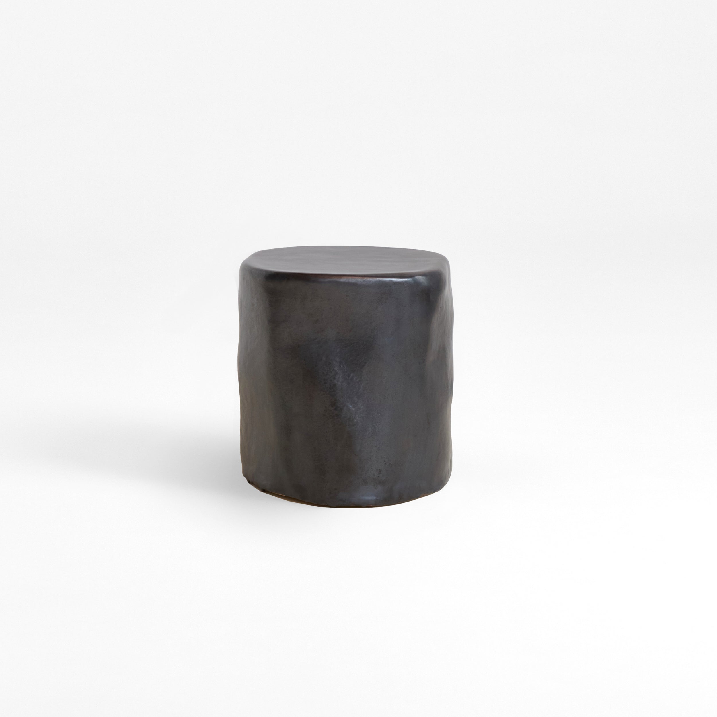 Ceramic Side Table (small) — back view of black ceramic finish