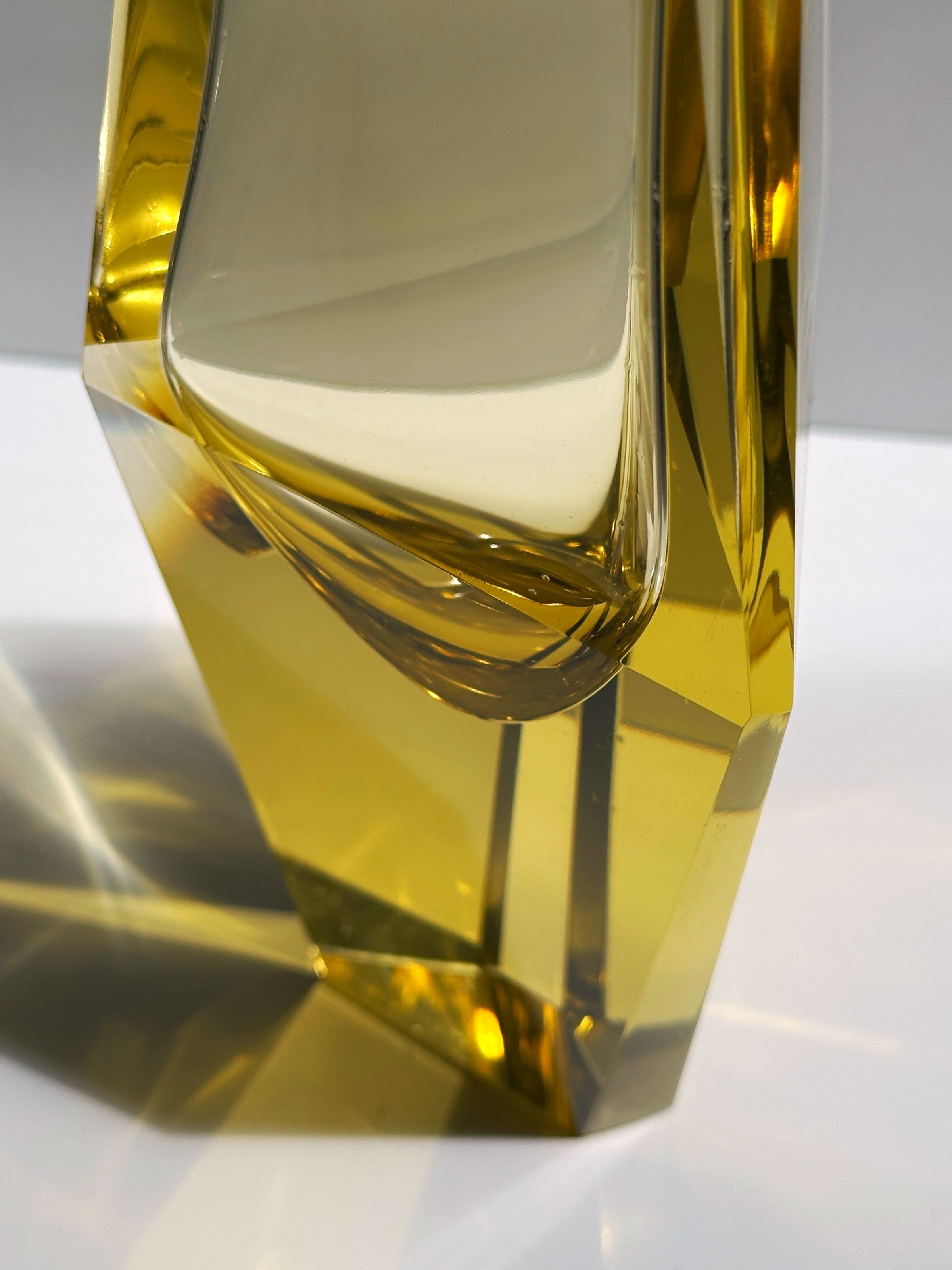 Golden Murano glass vase detail showing curved prismatic form