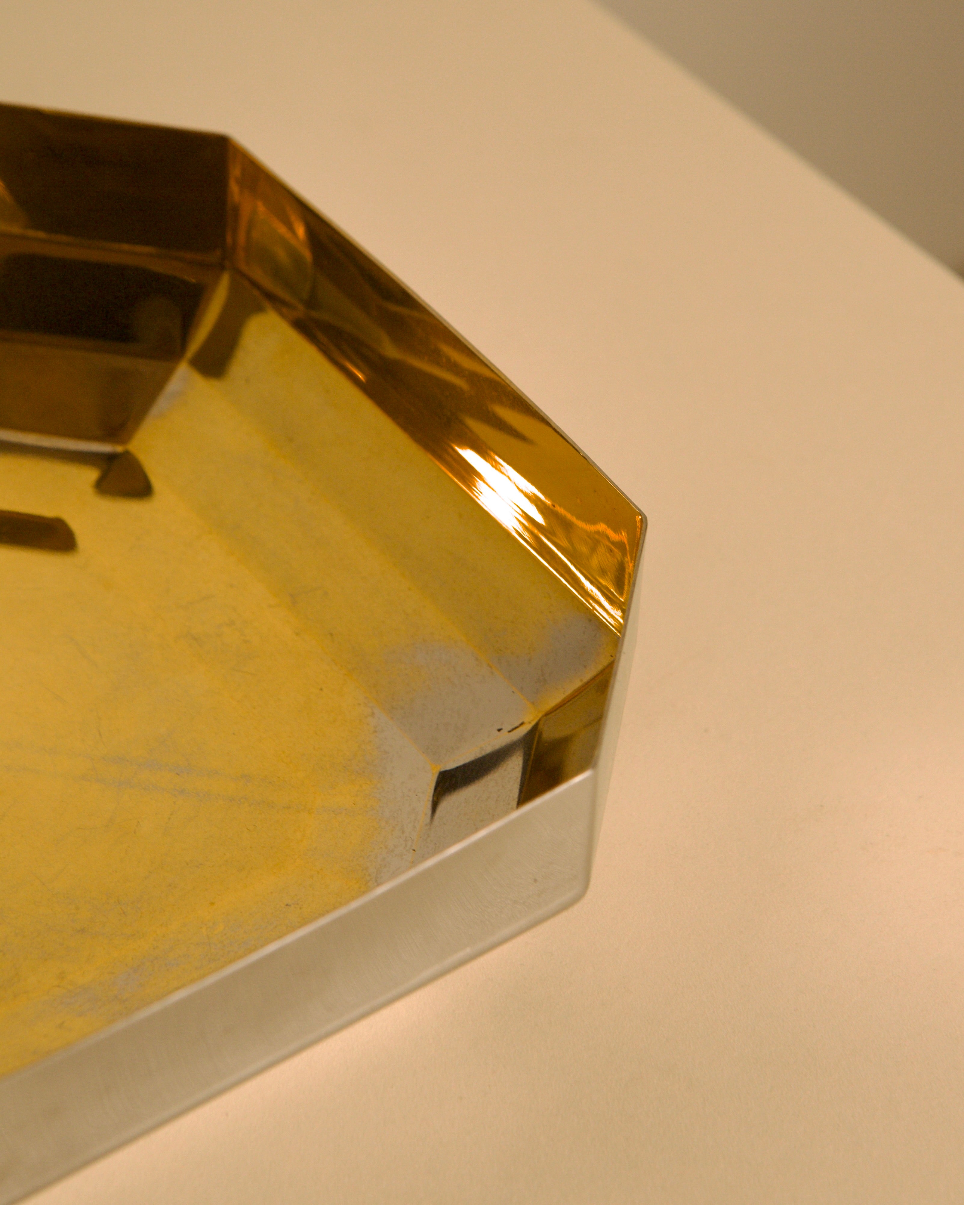 Large Italian silver and gold stainless steel trinket tray from the 80s — lifestyle setting