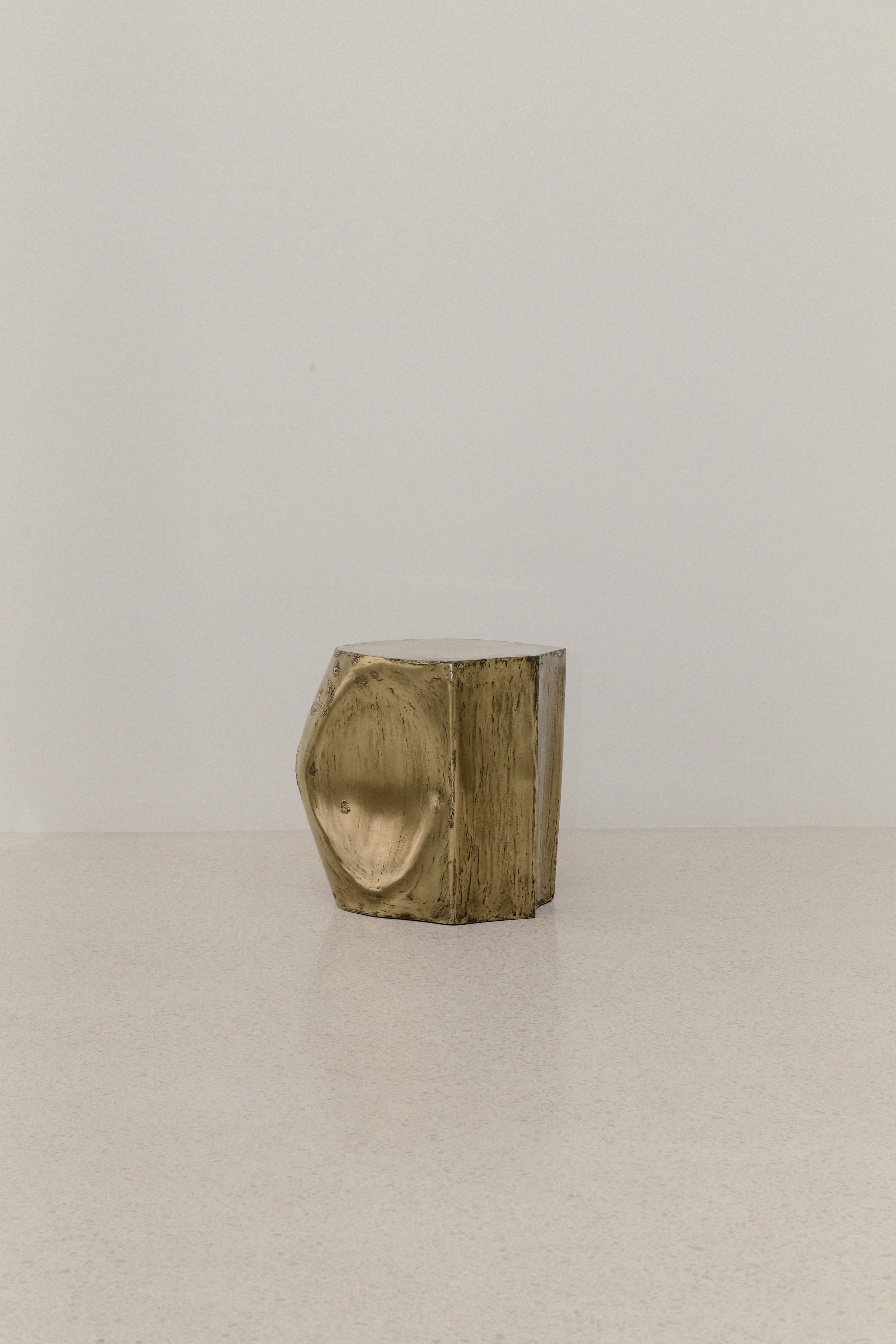 ROCHER SMALL TABLE IN POLISHED BRASS RESIN — top view on light surface