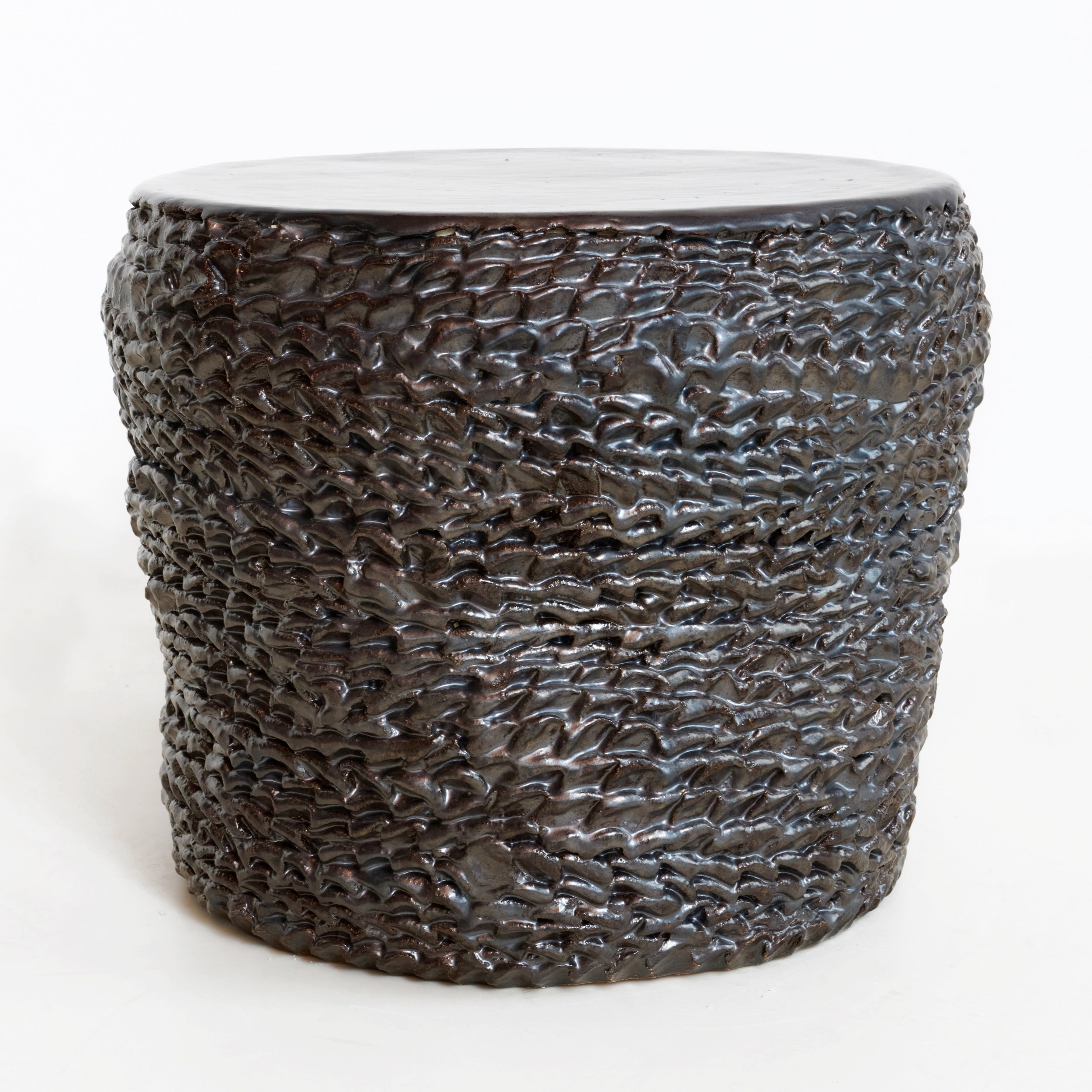Casa Ceramic Side Table — side view highlighting textured dark ceramic surface