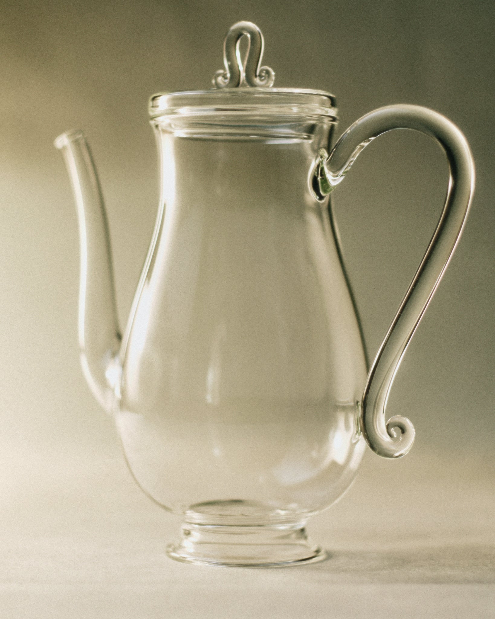 Bell Pot — clear glass teapot with curved handle