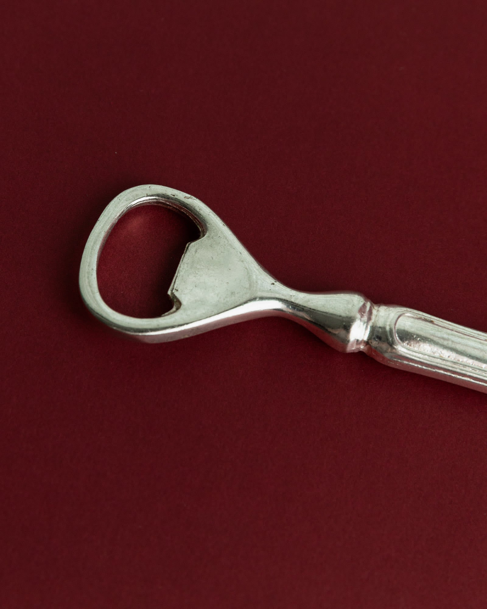 Vintage 1960s Silver Plated Bottle Opener, Classic Minimal Design — close-up of textured silver handle