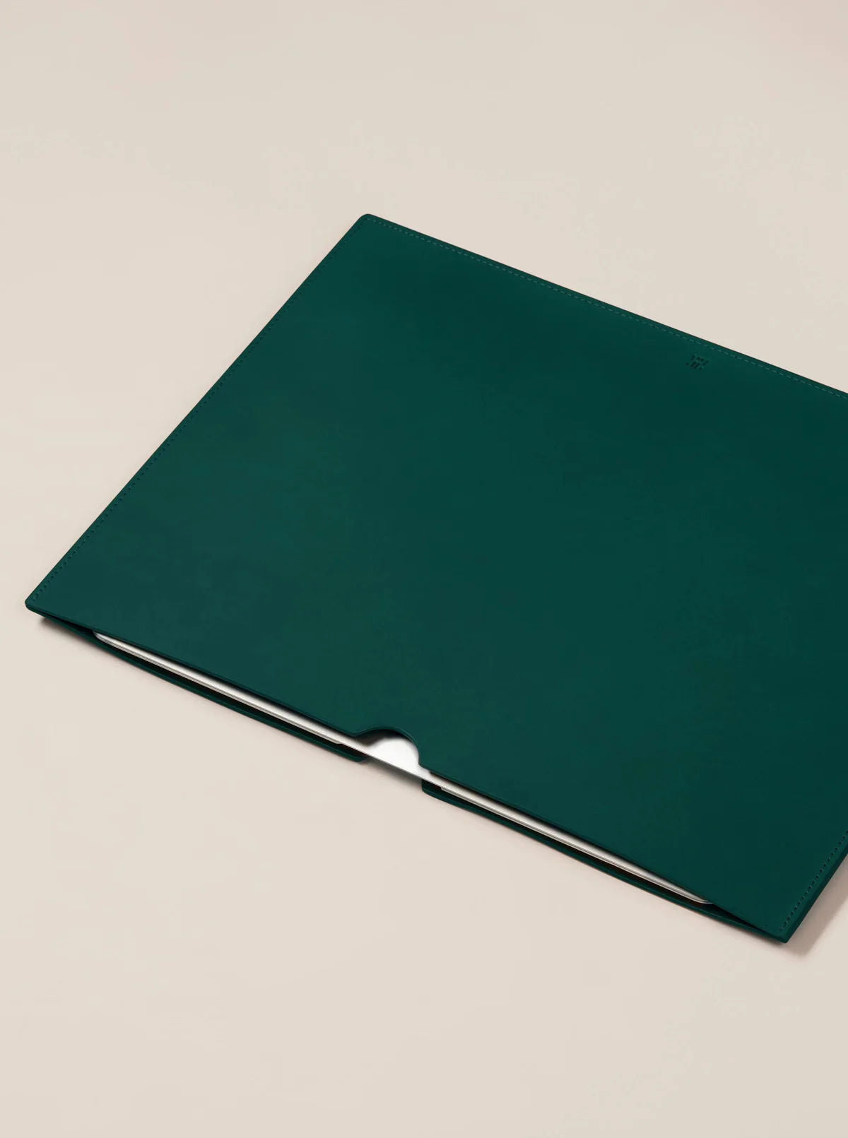 Leather Laptop Sleeve — angled view on neutral background