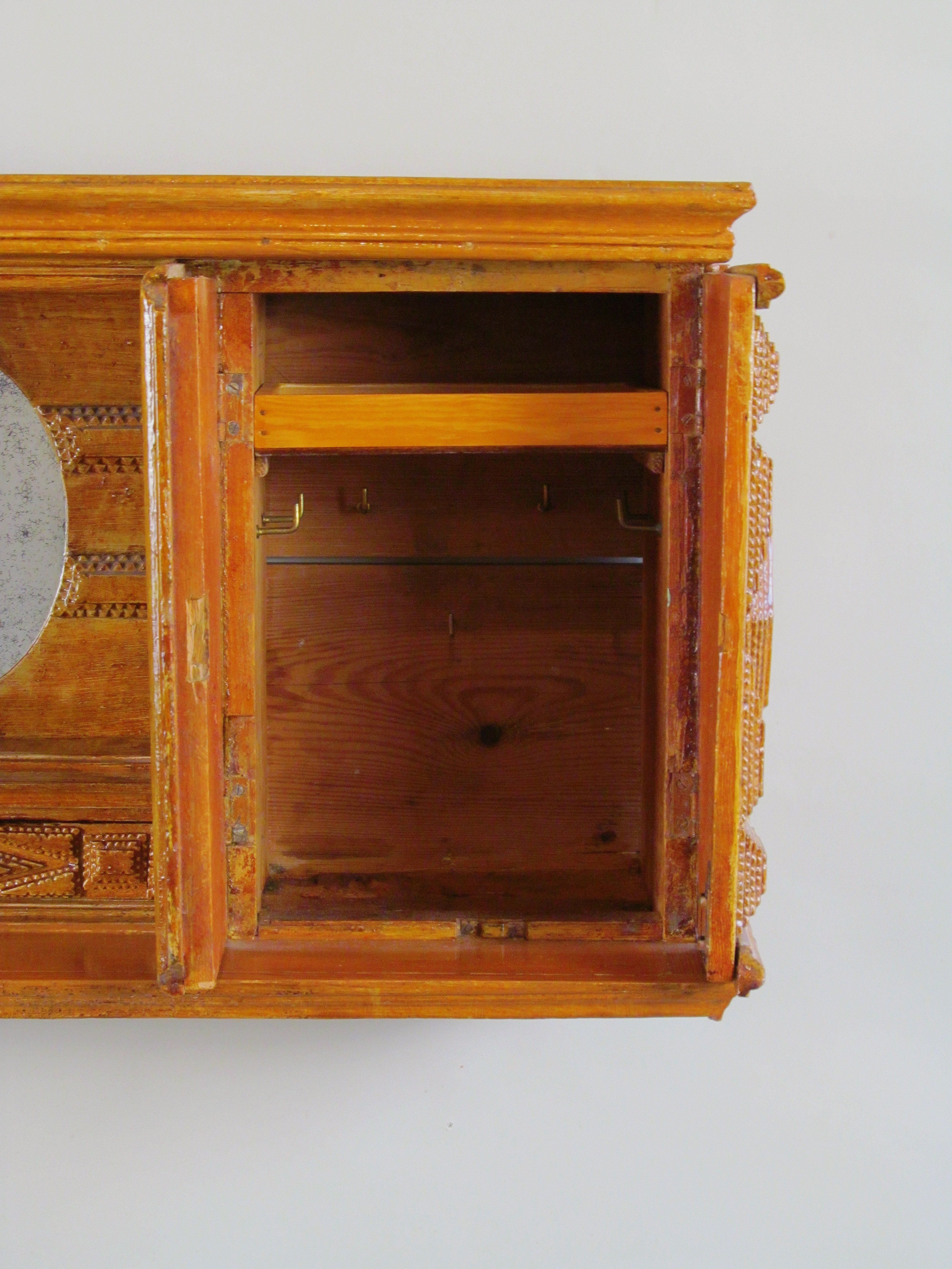 Tramp Art Wall Shelf 1890 - 1915 — top view showing wooden interior and hooks