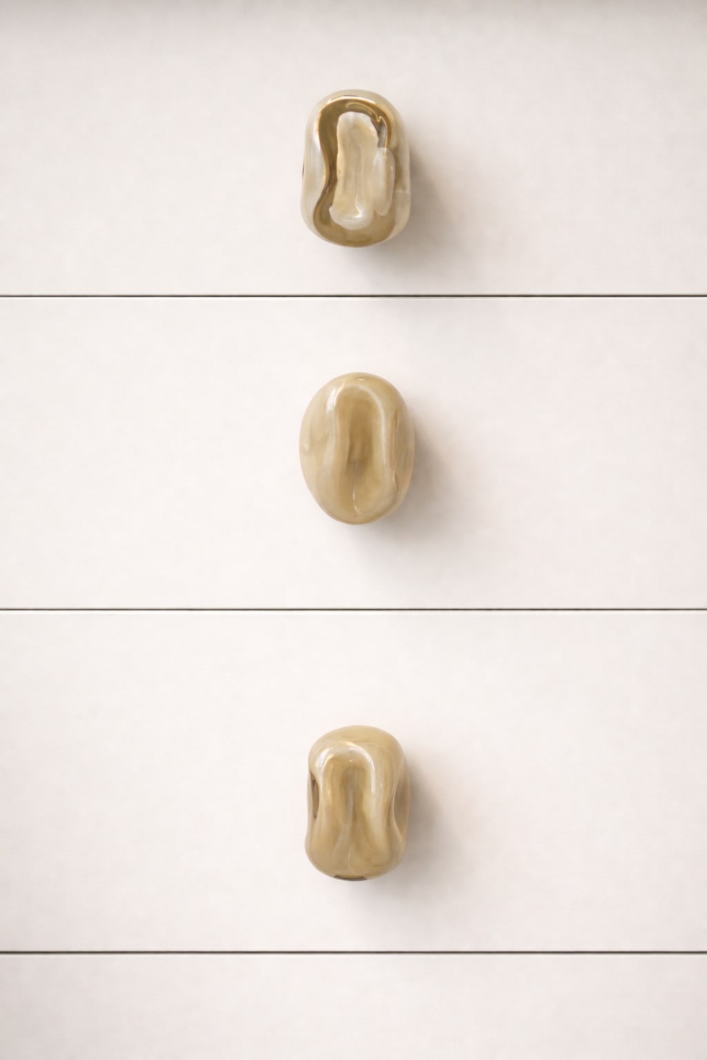 Knobs Collection Sculptures in Glass — side view of three glass knobs