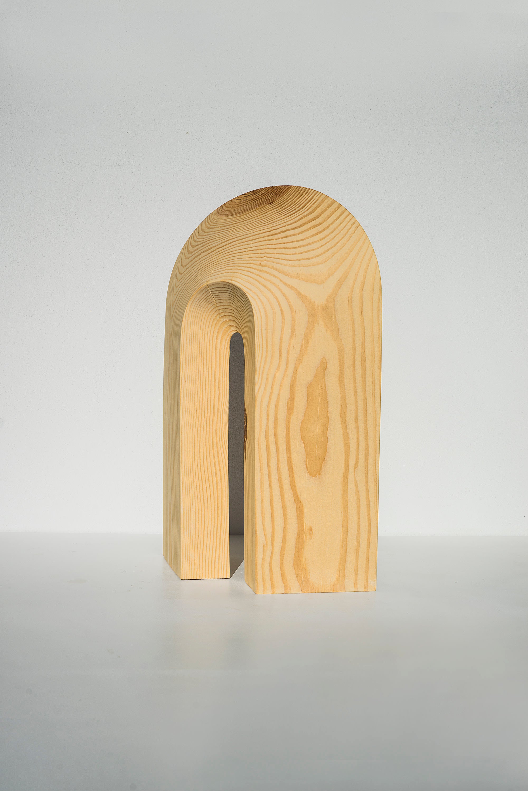 Sculptures — side angle of handcrafted wooden arch design