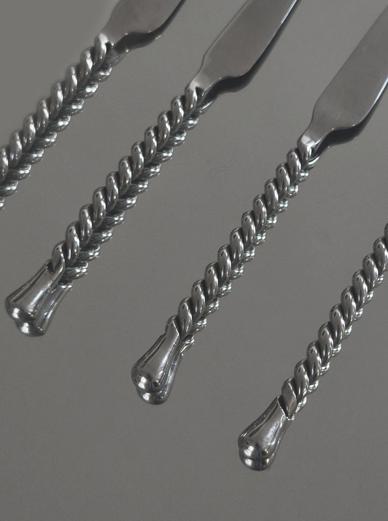 Twisted silver handles detail of luxury cheese knife set