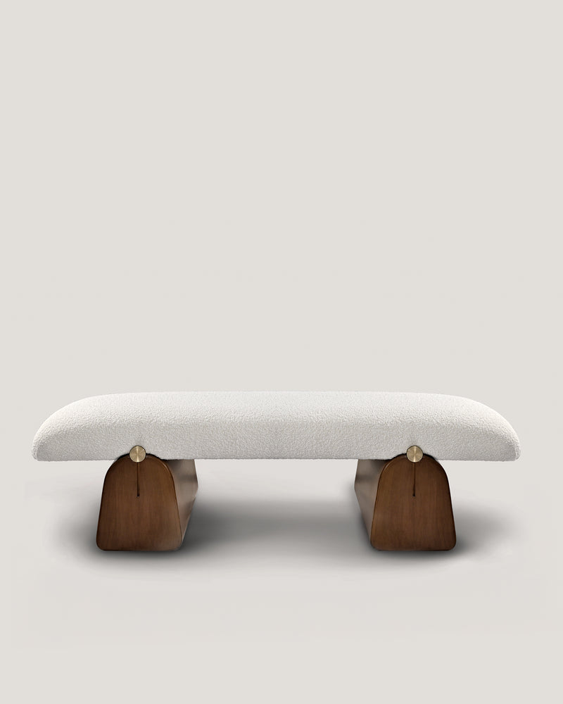 Modern upholstered bench with curved wooden base by Buket Hoscan