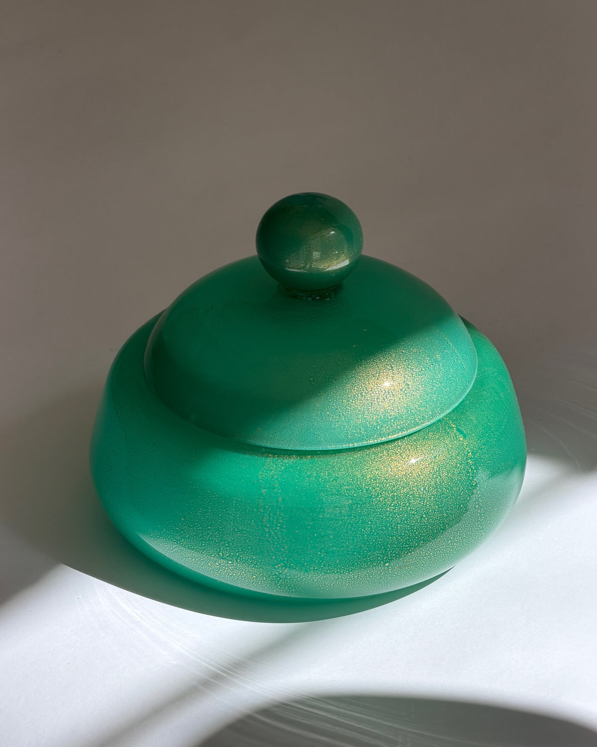 Vintage large green/golden Murano bonbonniere — lifestyle setting