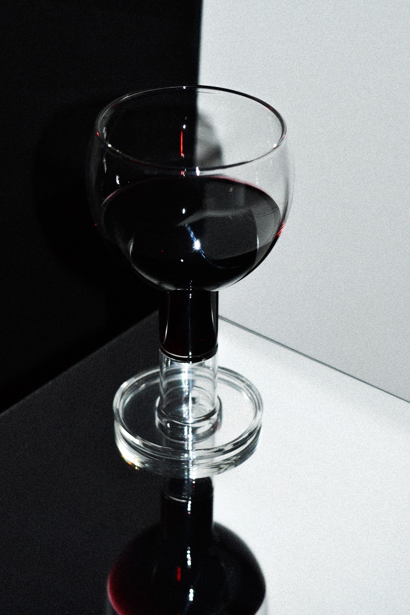 Set of 2 Wine Candle Glasses - Clear — angled view on reflective surface