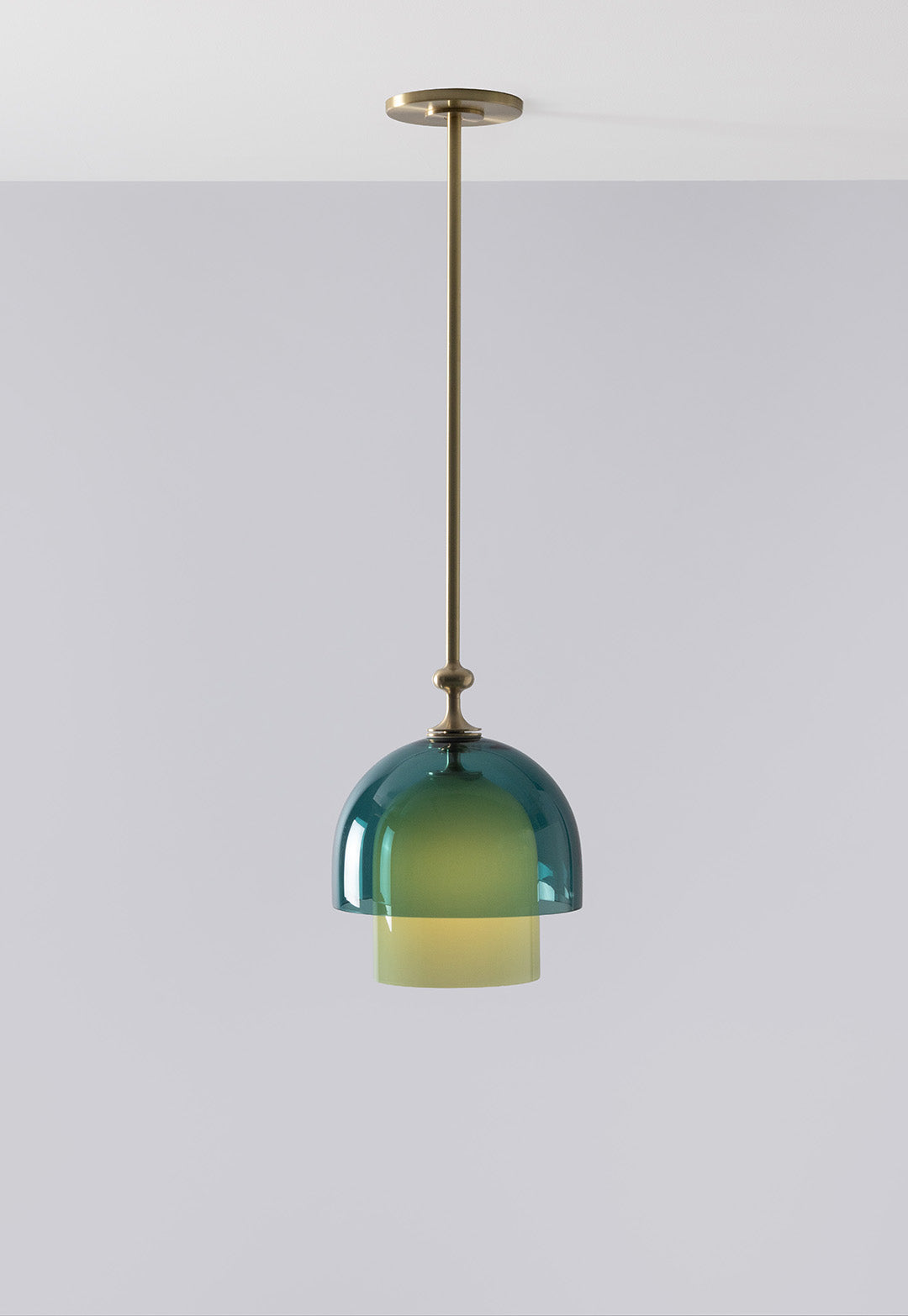 SkLO + AvroKO Elizabeth II Pendant - Light Beige and Olivin glass, Antique Brass finish — lifestyle setting