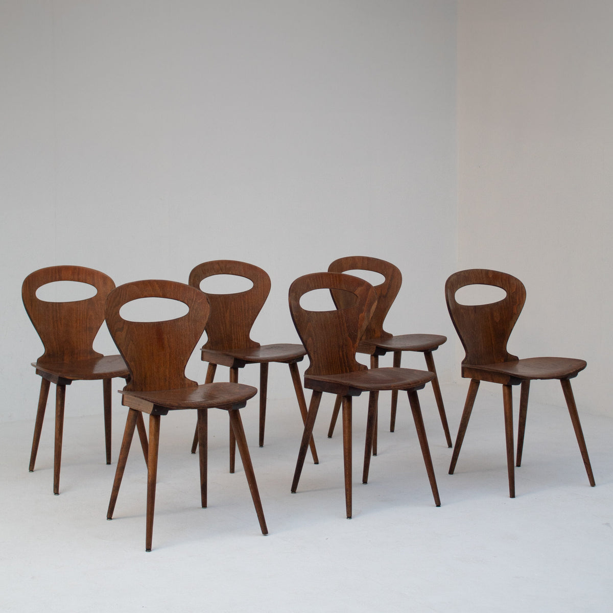 Set of Six Sculptural Wooden Dining Chairs by Malata Antwerp | The Oblist