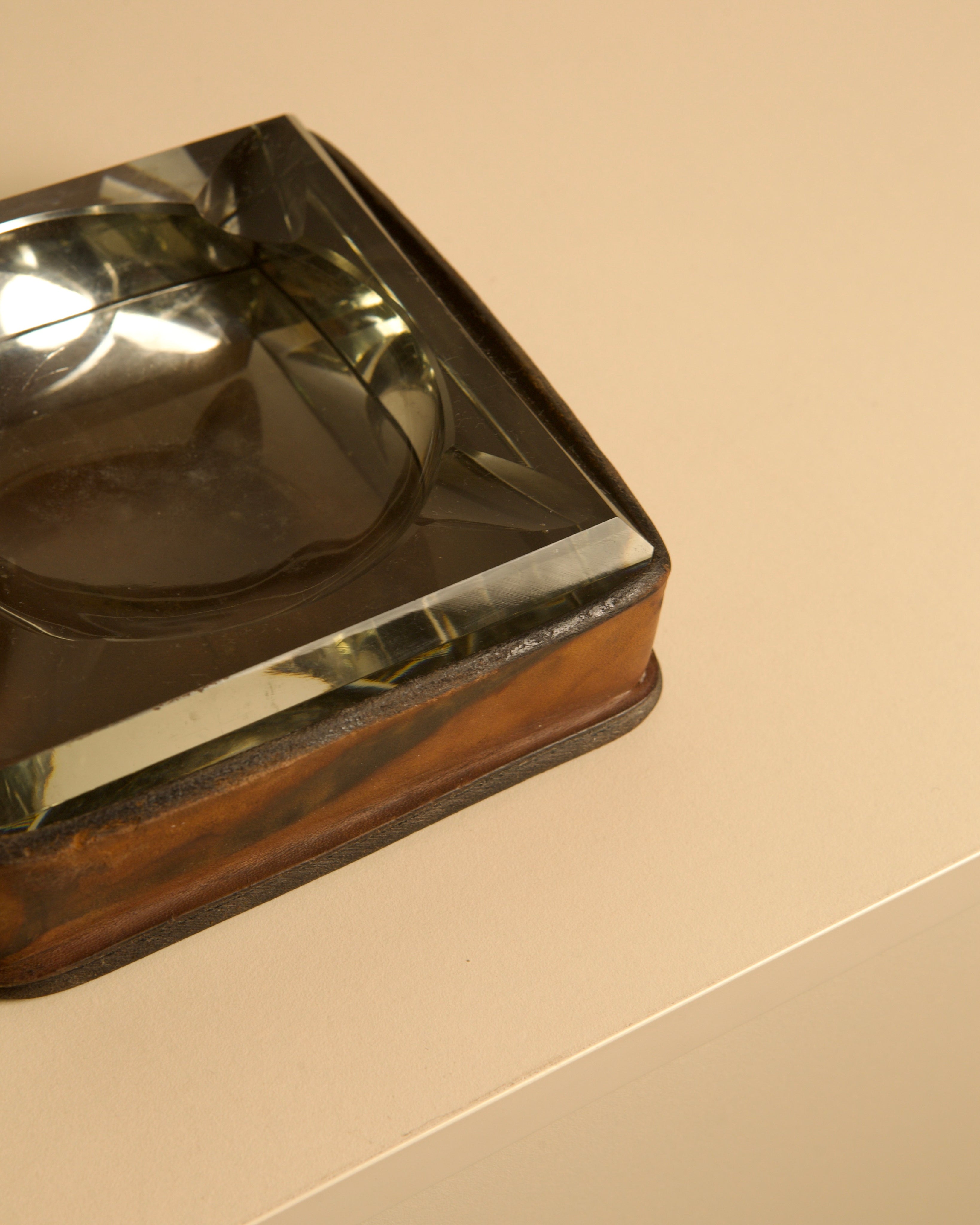 Italian Ashtray in Crystal and Leather 60's — side angle on neutral surface