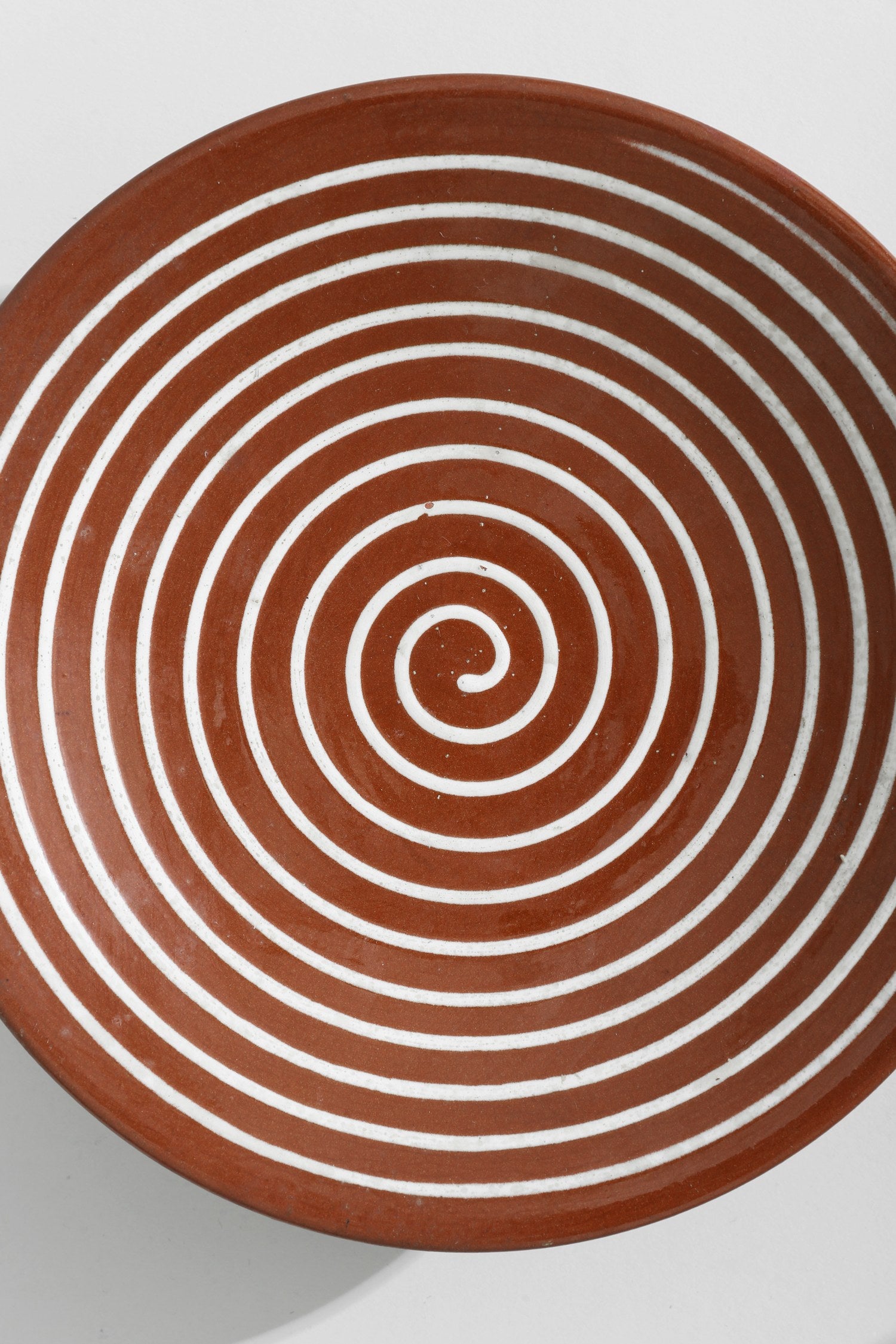 Spiral Pedestal Pottery Bowl — top view of terracotta with white stripes