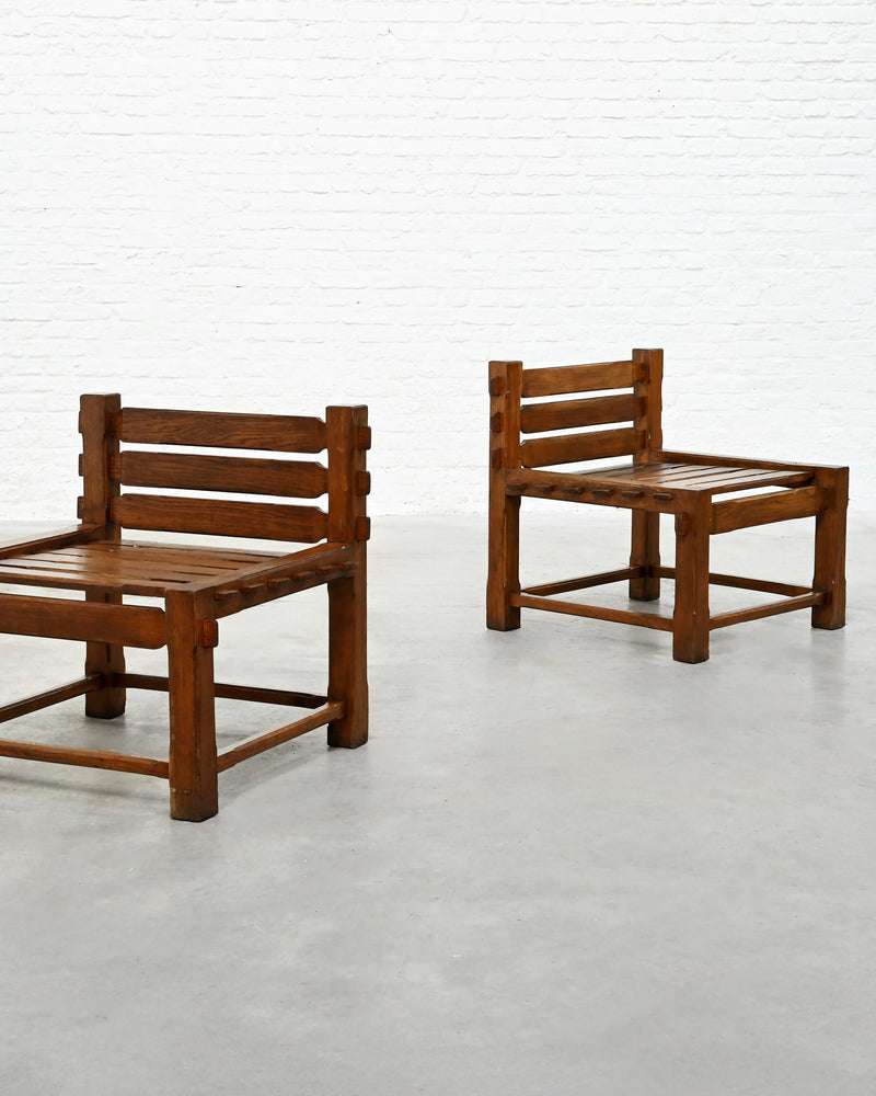 Two 1970s brutalist oak side chairs showing slatted seats and backs