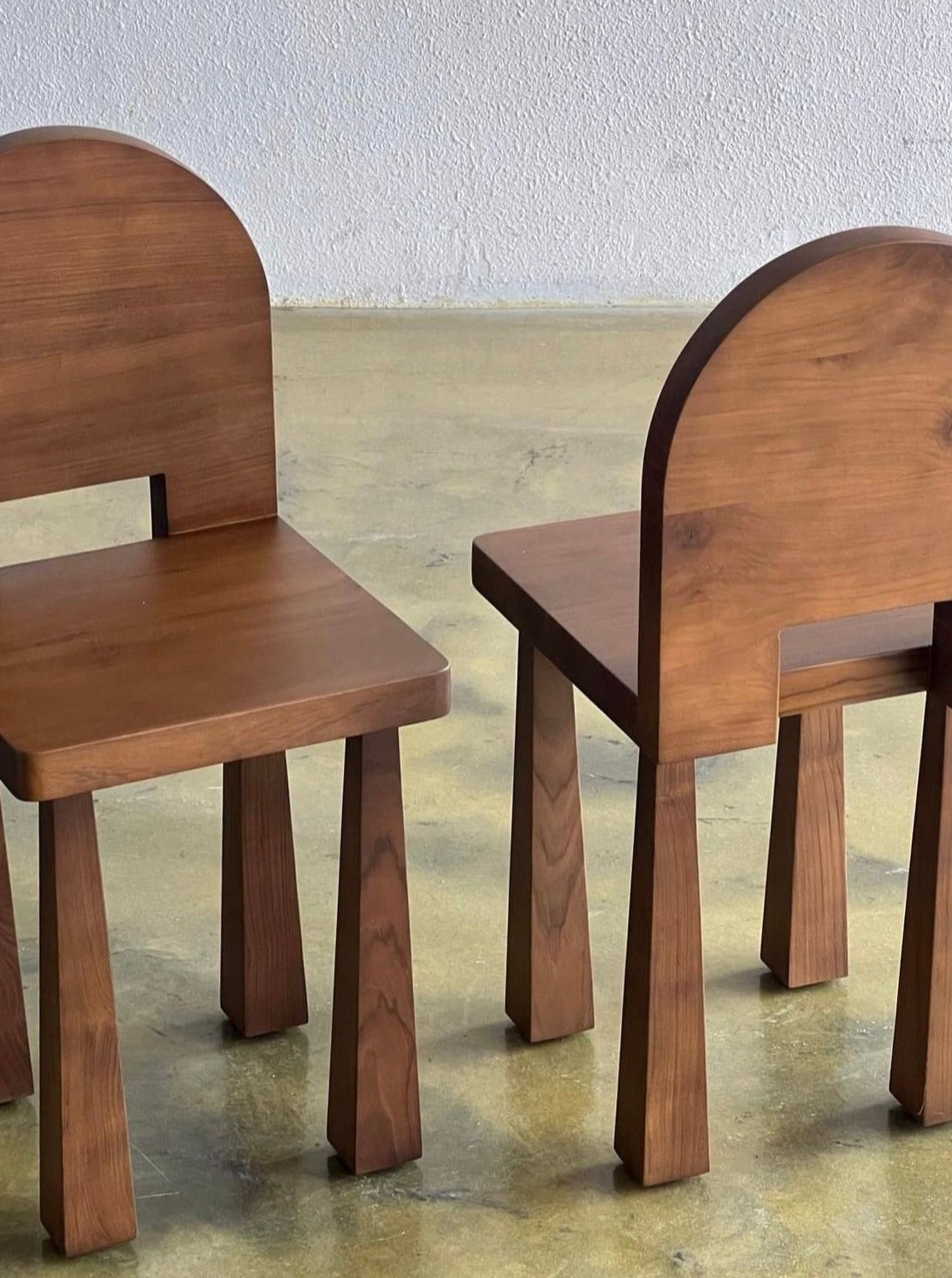 Luna Chair II — two wooden chairs in minimalist interior setting