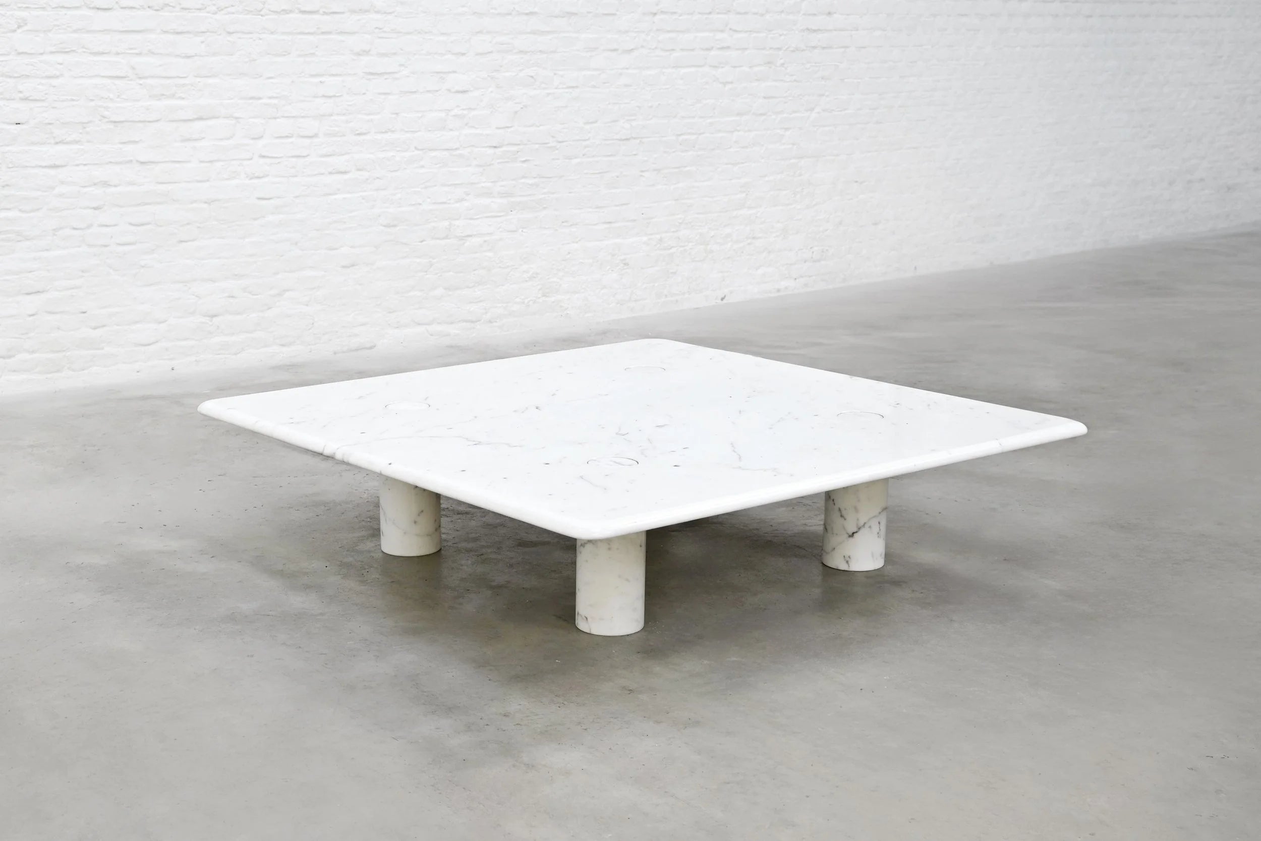 Angelo Mangiarotti Carrara Marble Coffee Table, Italy 1970's — angled view highlighting white marble surface and cylindrical