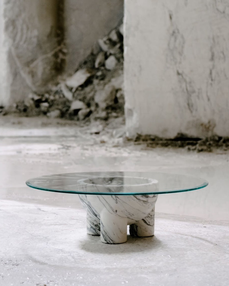 Modern glass coffee table with twisted Arabescato marble base