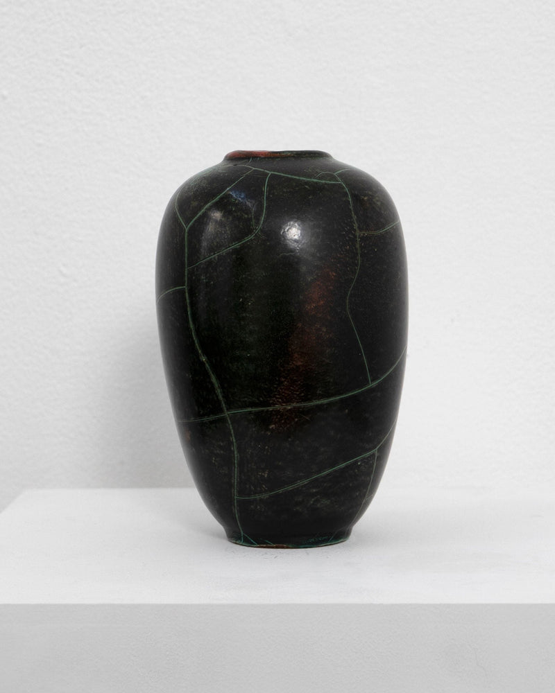 Dark ceramic vase with green linear pattern by Richard Uhlemeyer