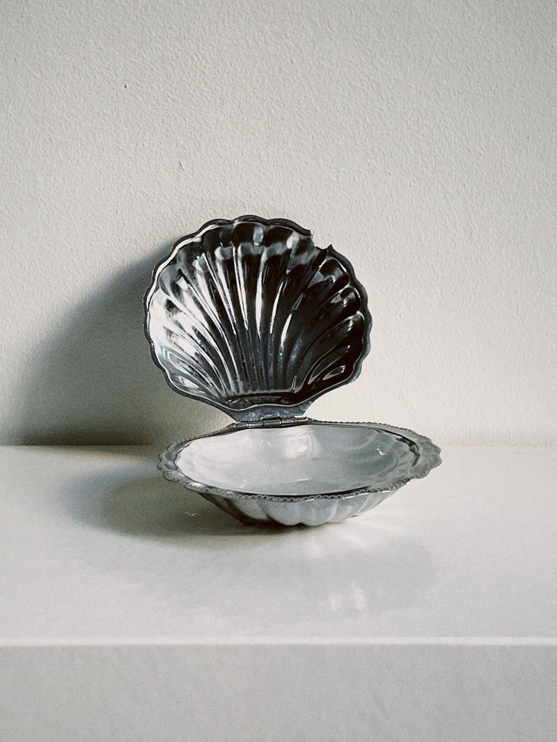 Dark glass shell-shaped butter dish with scalloped ridges open display