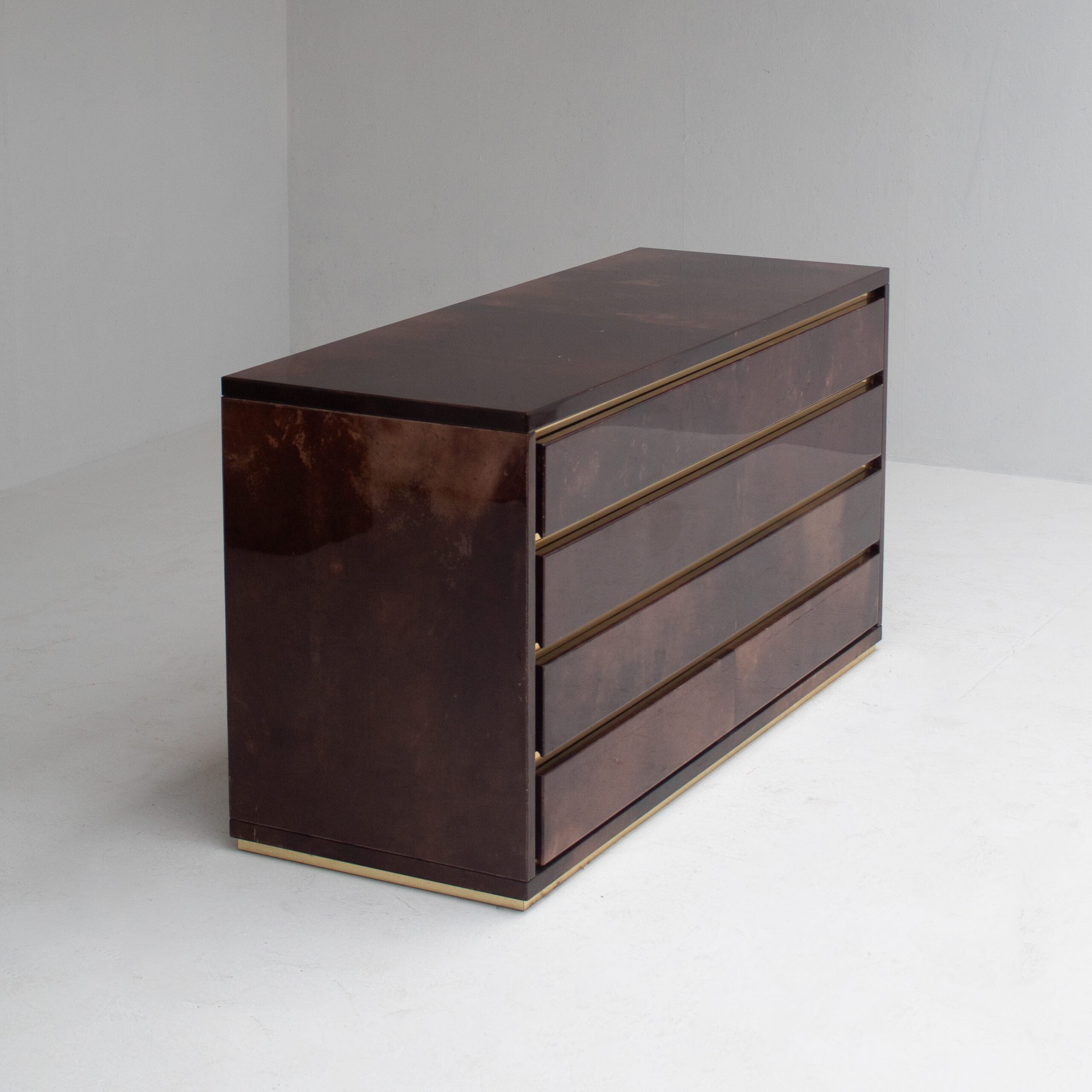 Aldo Tura Cabinet in Brown Lacquer with Brass Details — side angle showing four drawers and brass trim