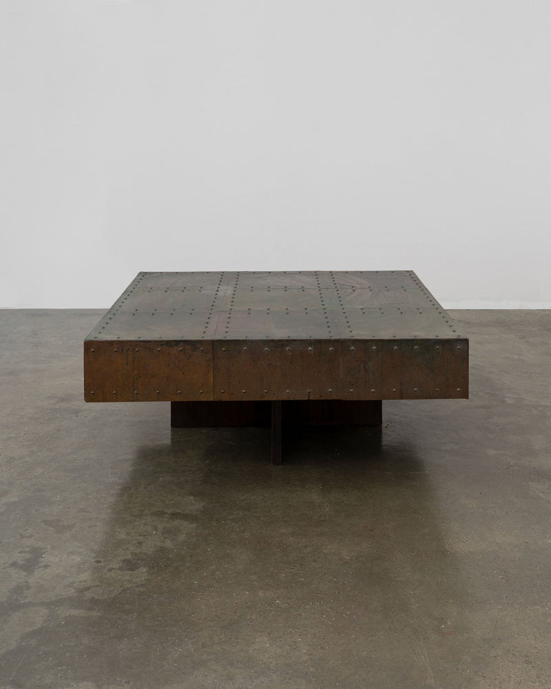 Brutalist copper coffee table with riveted surface and pedestal base