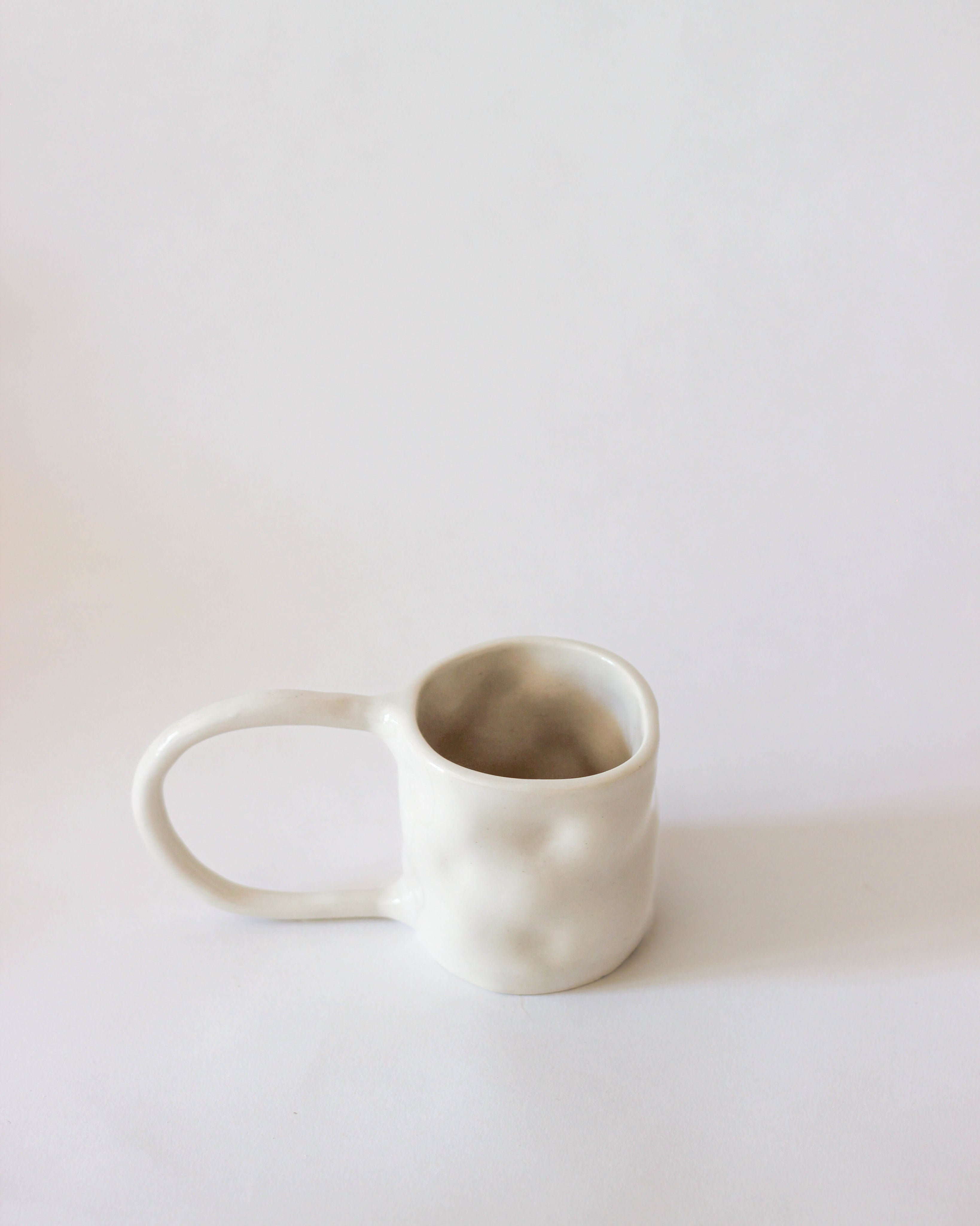 Stoneware Mugs — side angle showing matte white finish