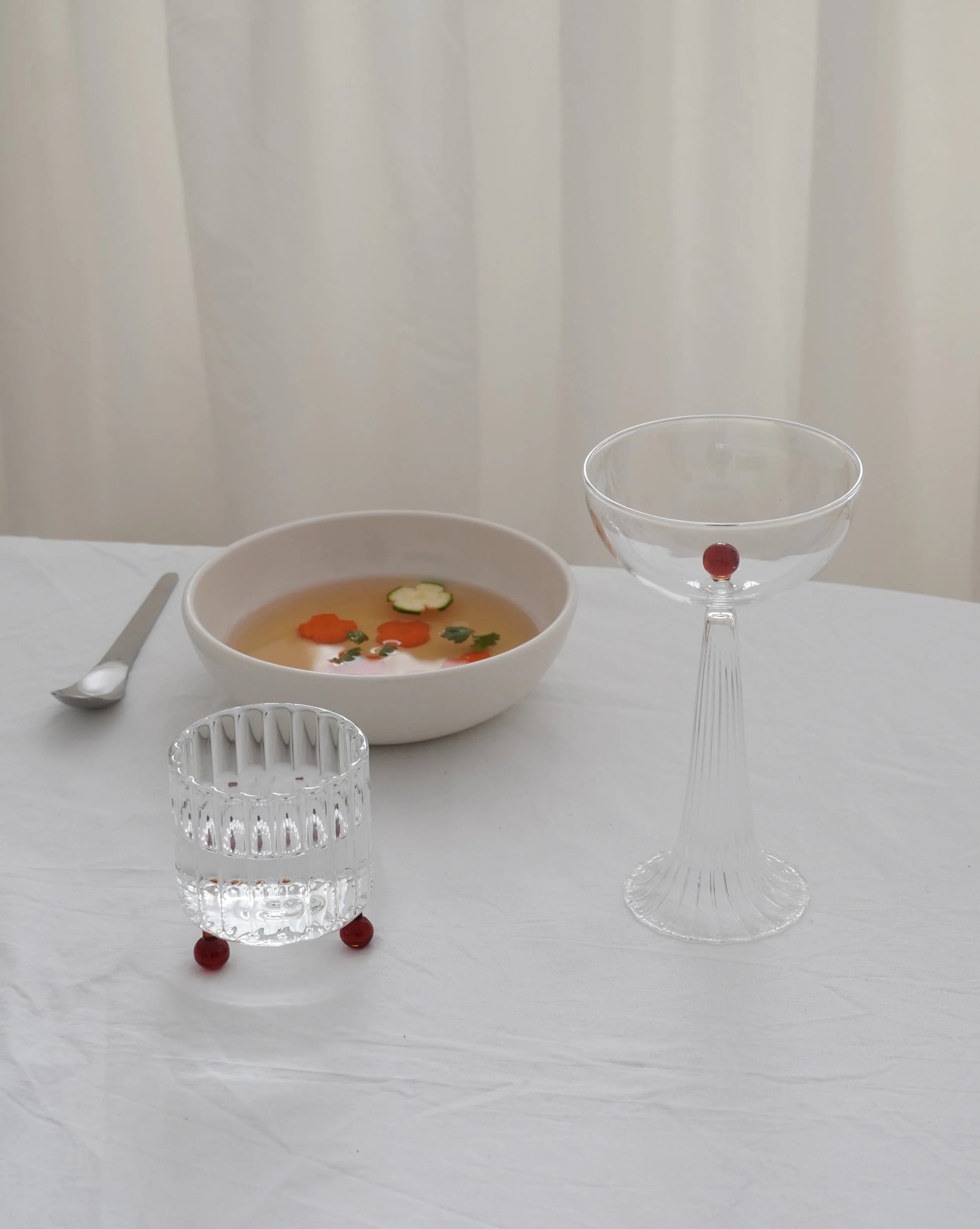 High Spirits — Hand-blown Lowball Glass in Red Amber — lifestyle setting