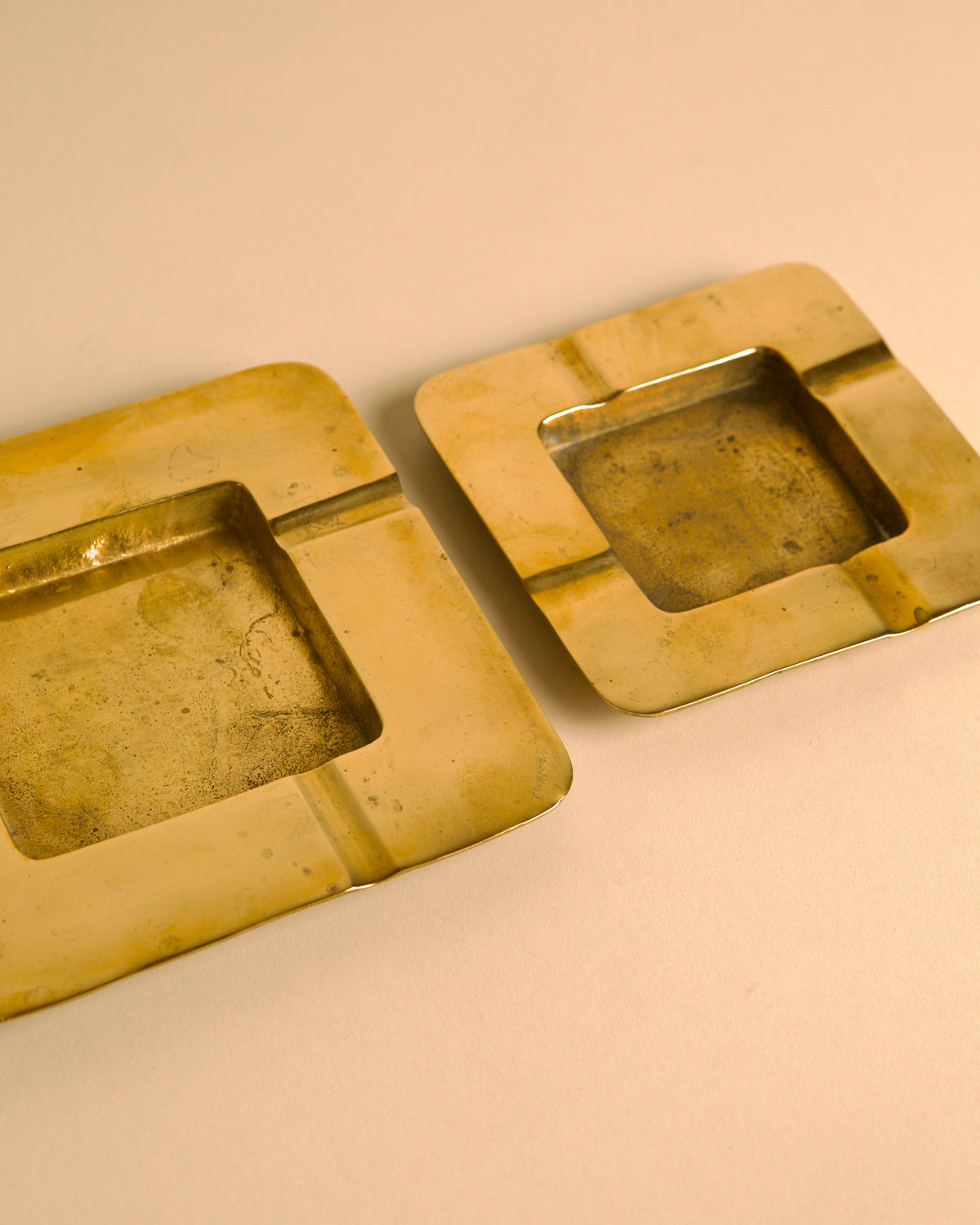 Pair of Italian hammered brass ashtrays, 1960s — side angle