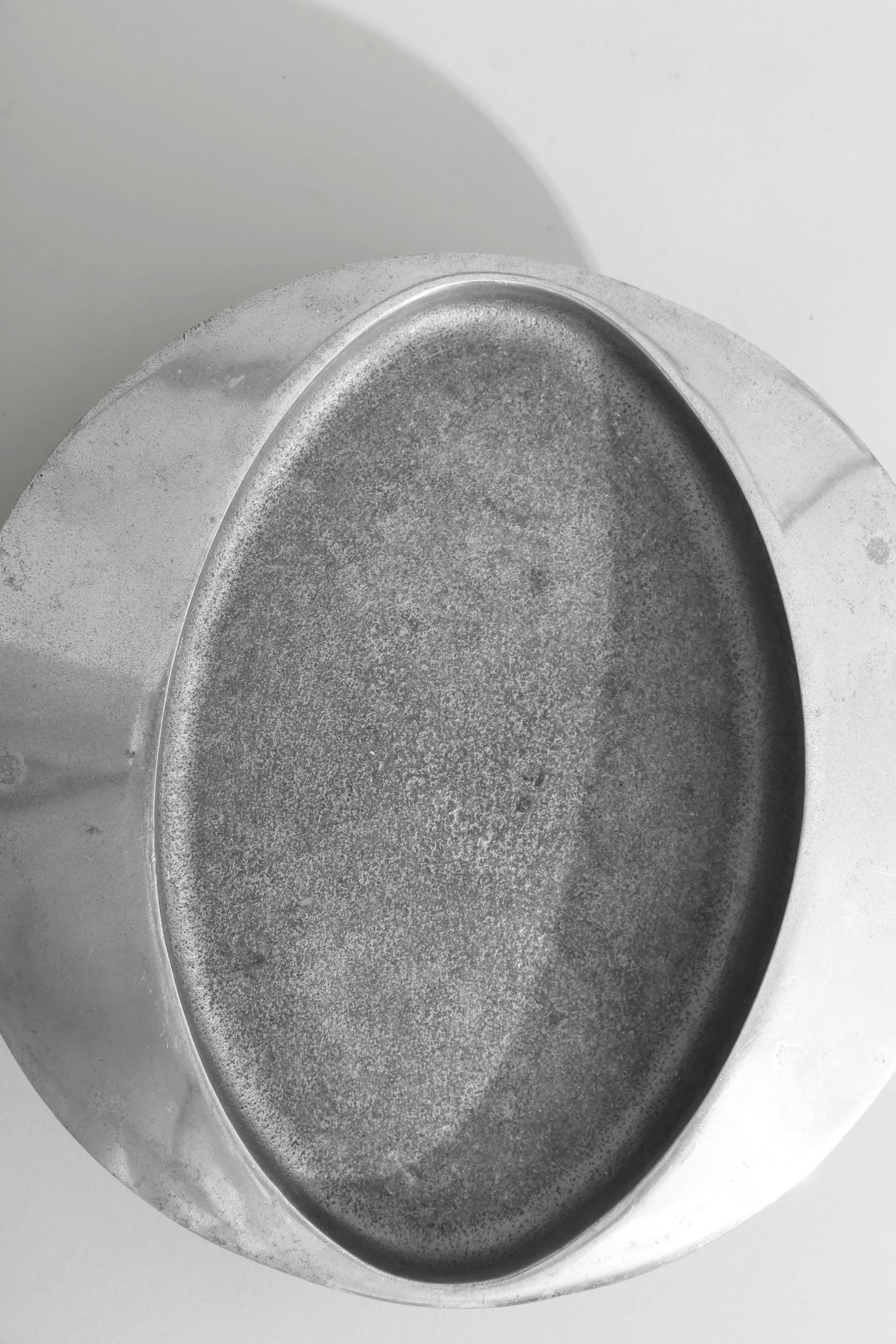 Brutalist Chrome Catchall — top view of textured chrome surface