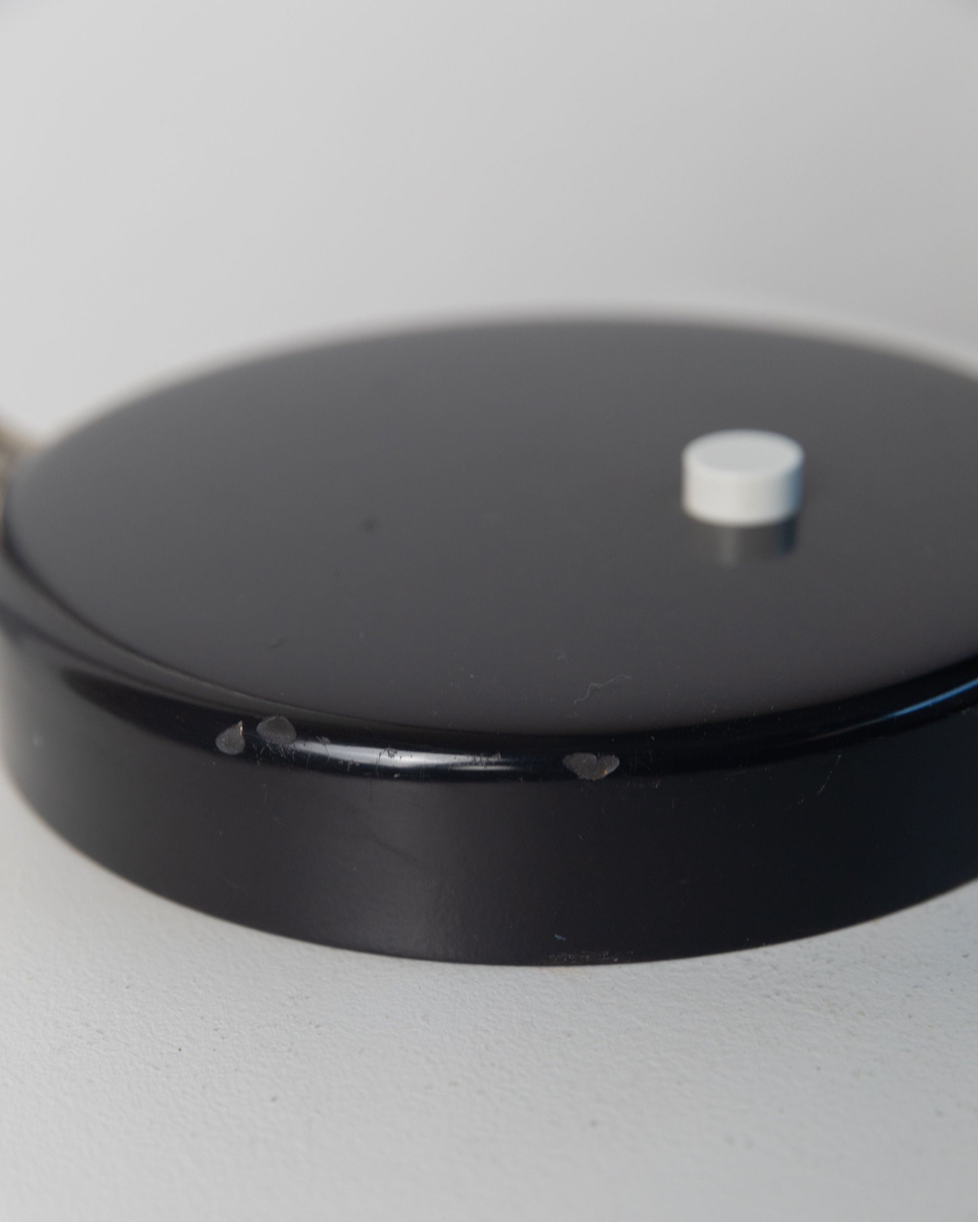 Table Lamp by Kaiser Idell, 1960s — close-up of black metal base