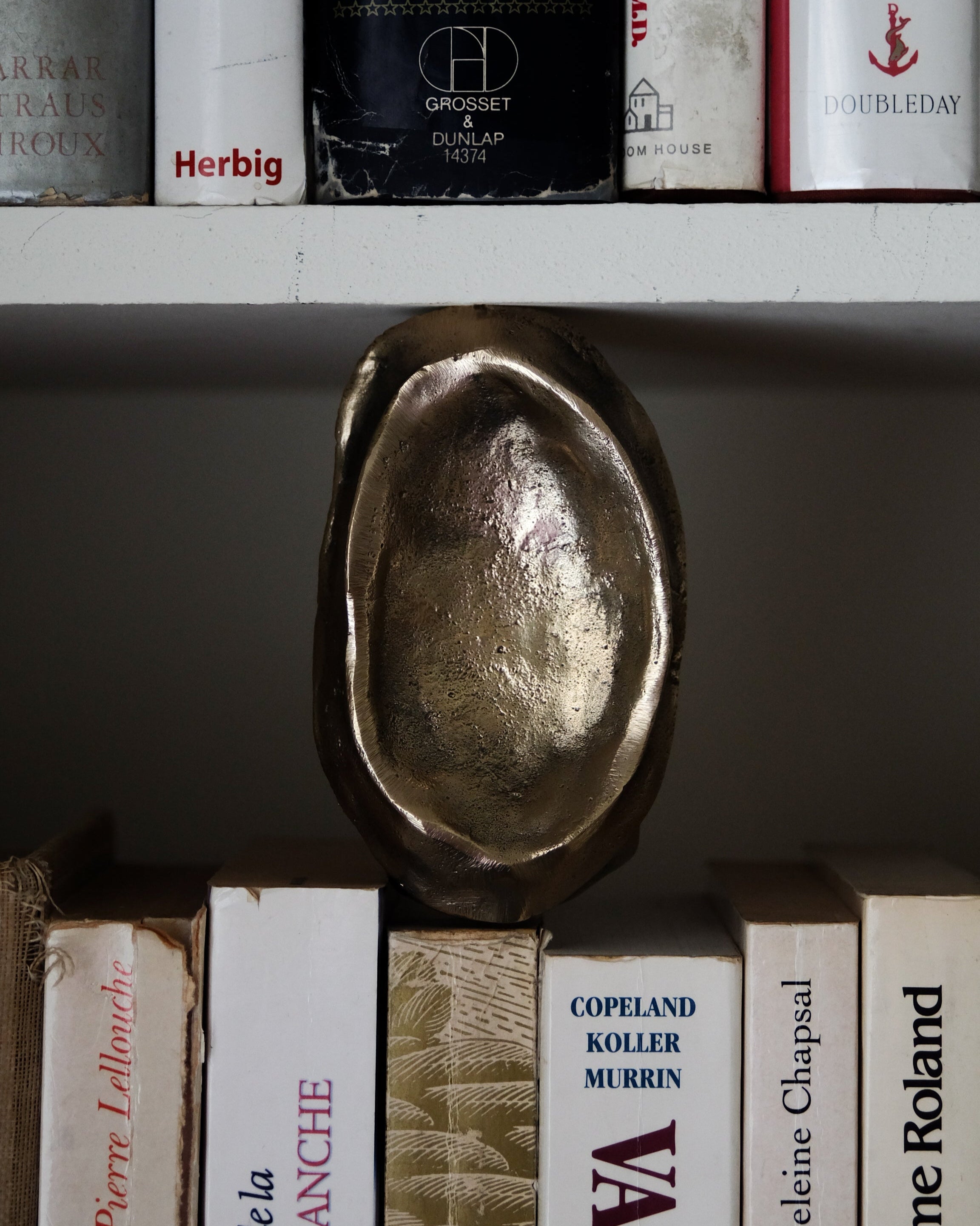MOORE Tray/Catchall — close-up of metallic surface on bookshelf