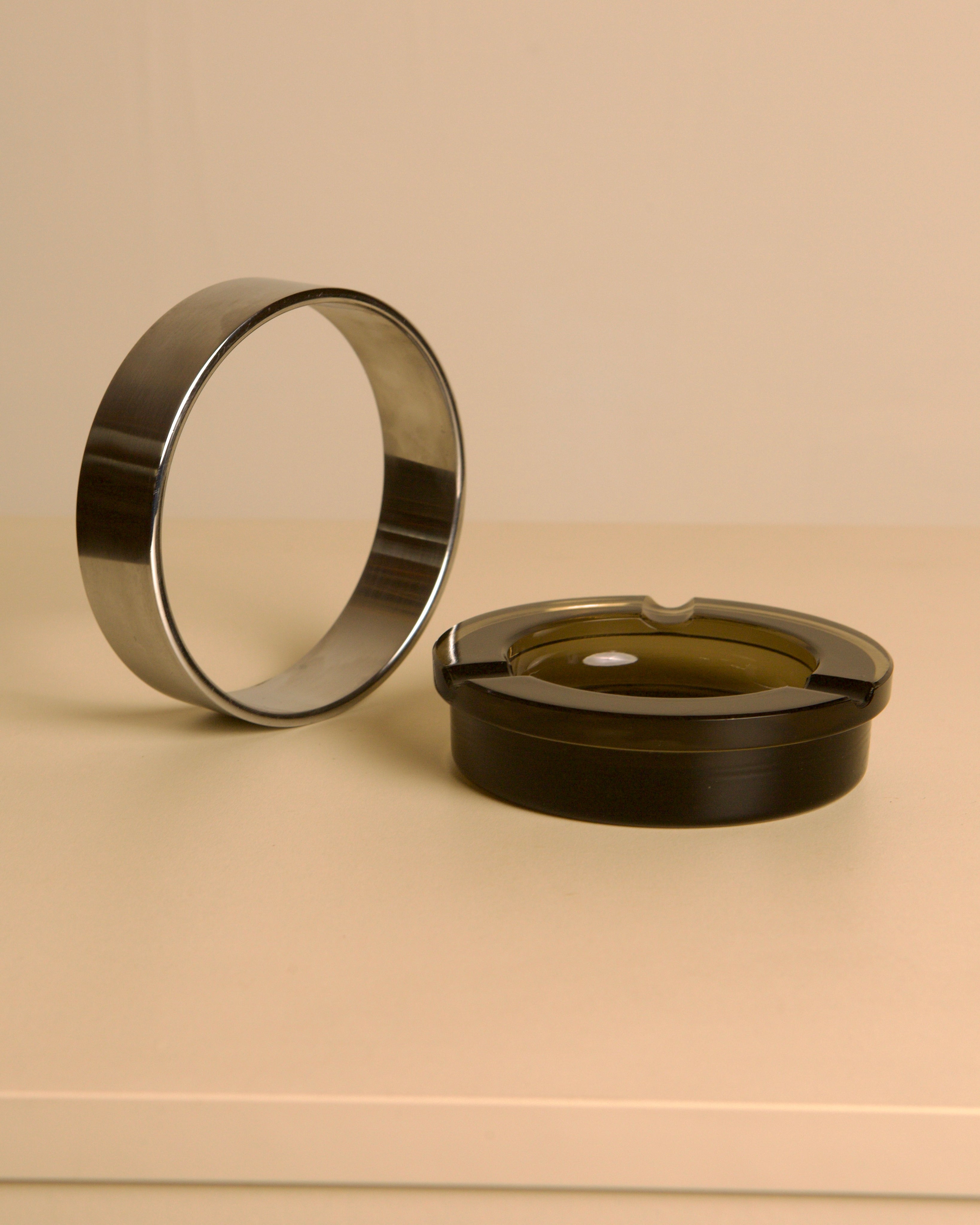 Italian circular metal and amber glass ashtray, 1970s — lifestyle setting