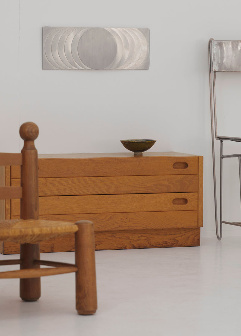 ‘The Sun’s Path' Steel Wall Sculpture By Anonymous French Artist Circa 1970 — detail view on wooden dresser in modern interio