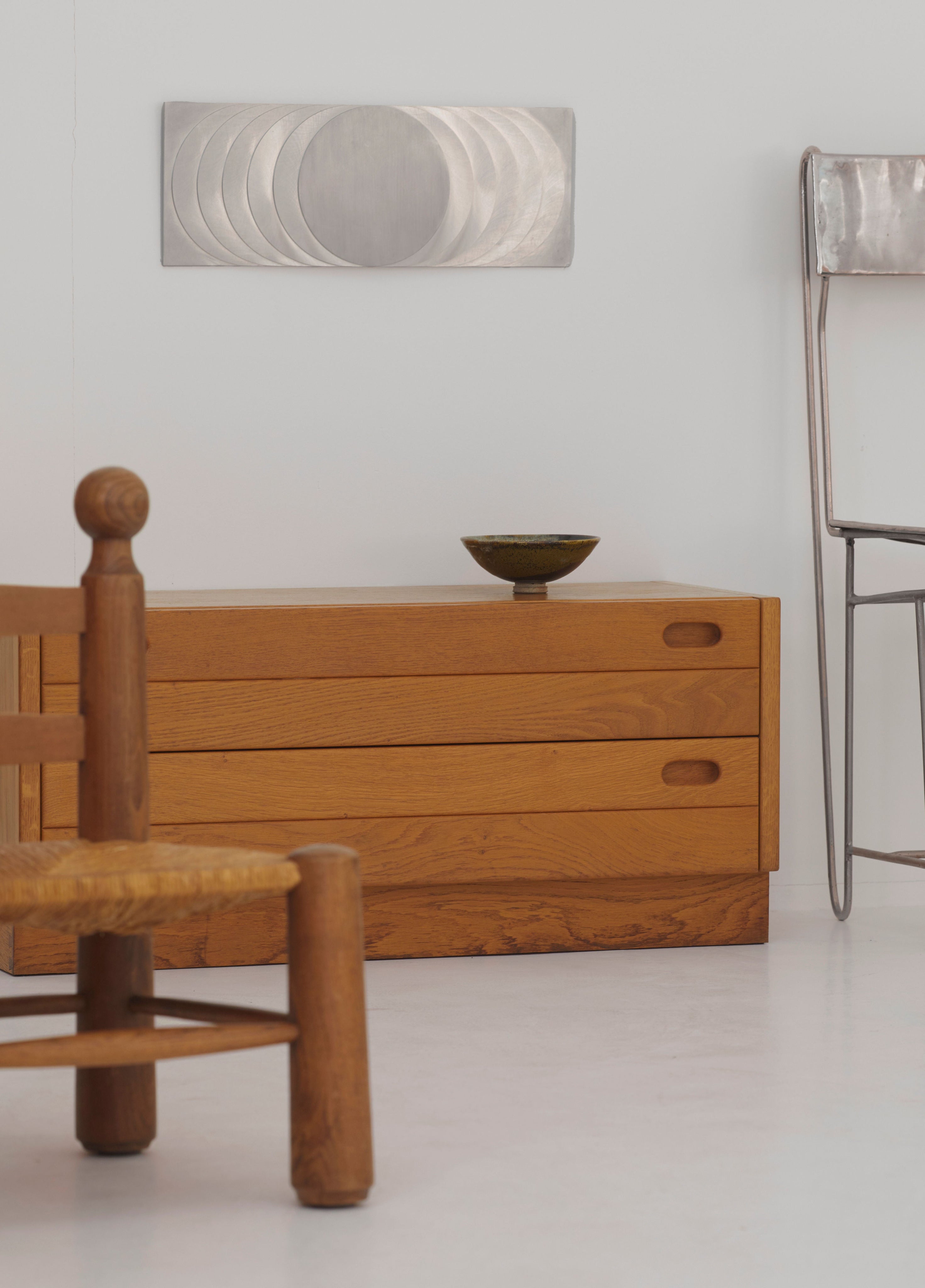 ‘The Sun’s Path' Steel Wall Sculpture By Anonymous French Artist Circa 1970 — detail view on wooden dresser in modern interio